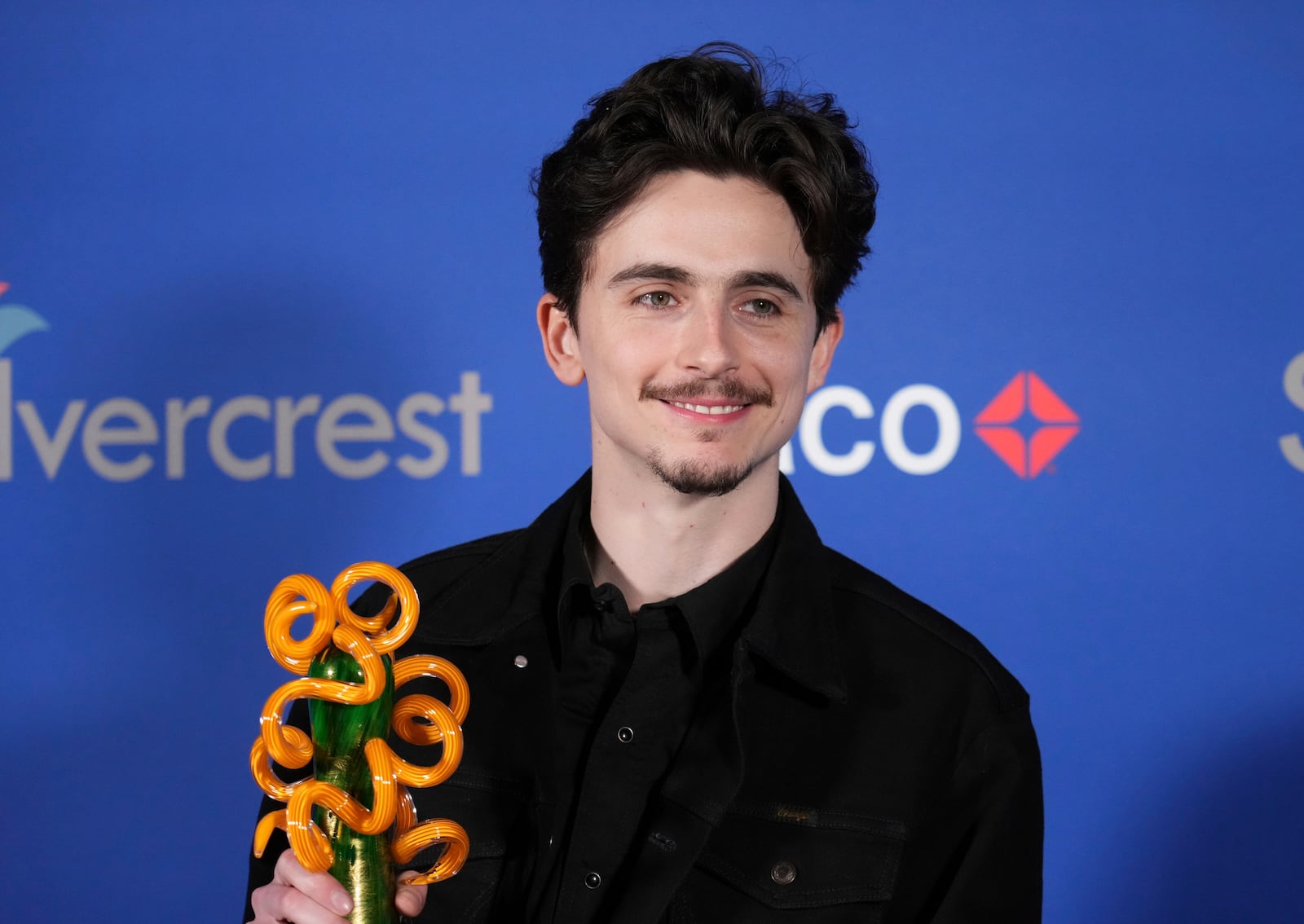 Timothee Chalamet poses with the chairman's award for "A Complete Unknown" in the press room during the 36th annual Palm Springs International Film Festival Awards Gala on Friday, Jan. 3, 2025, in Palm Springs, Calif. (Photo by Jordan Strauss/Invision/AP)