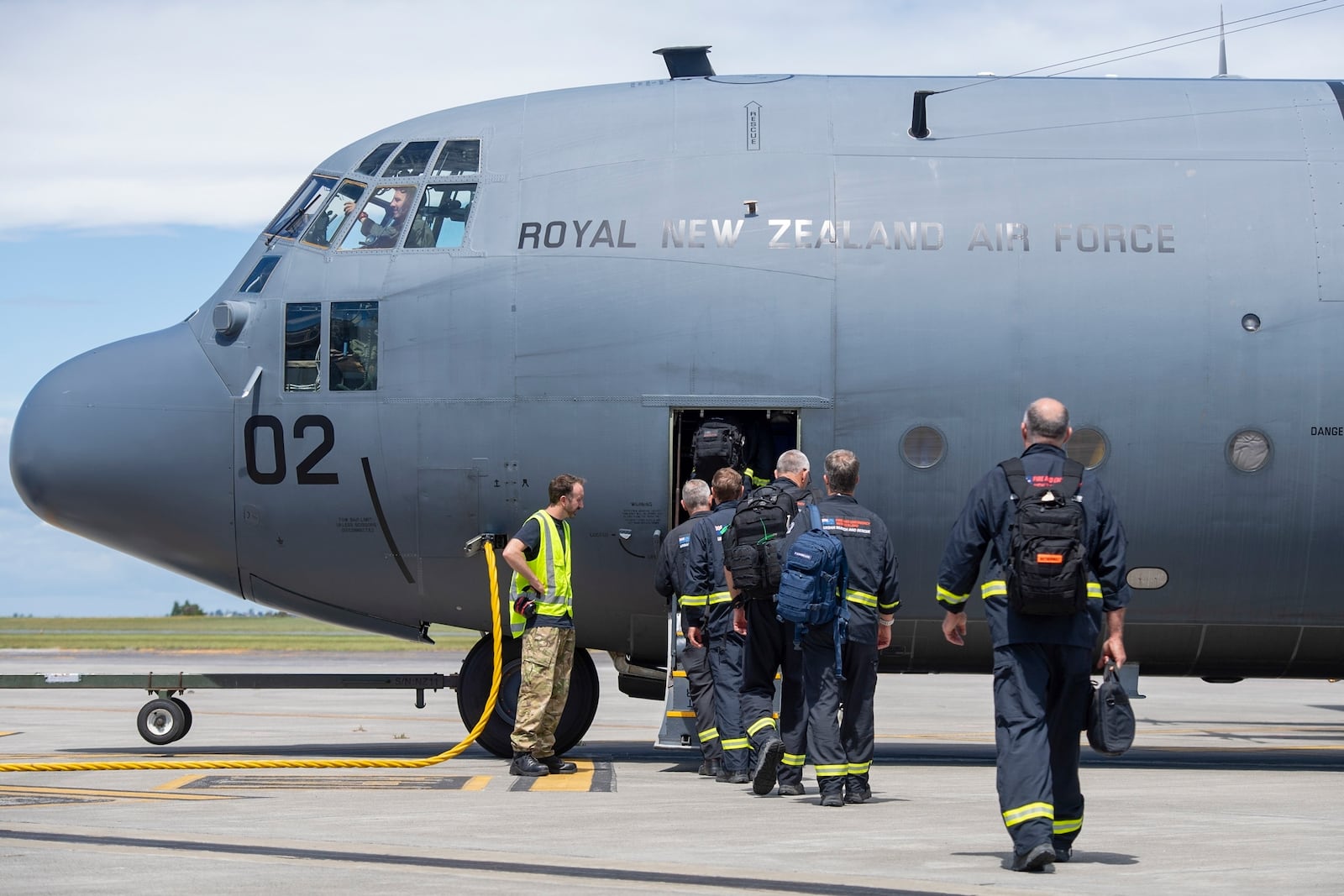 Members of the New Zealand Fire Service board a Royal New Zealand Air Force Hercules C130 H for a flight to Vanuatu, in Auckland, New Zealand, Wednesday, Dec. 18, 2024, following a magnitude 7.3 earthquake that struck just off the coast of Vanuatu in the South Pacific Ocean, Tuesday, Dec. 17. (SGT Maria Eves/New Zealand Defence Force via AP)