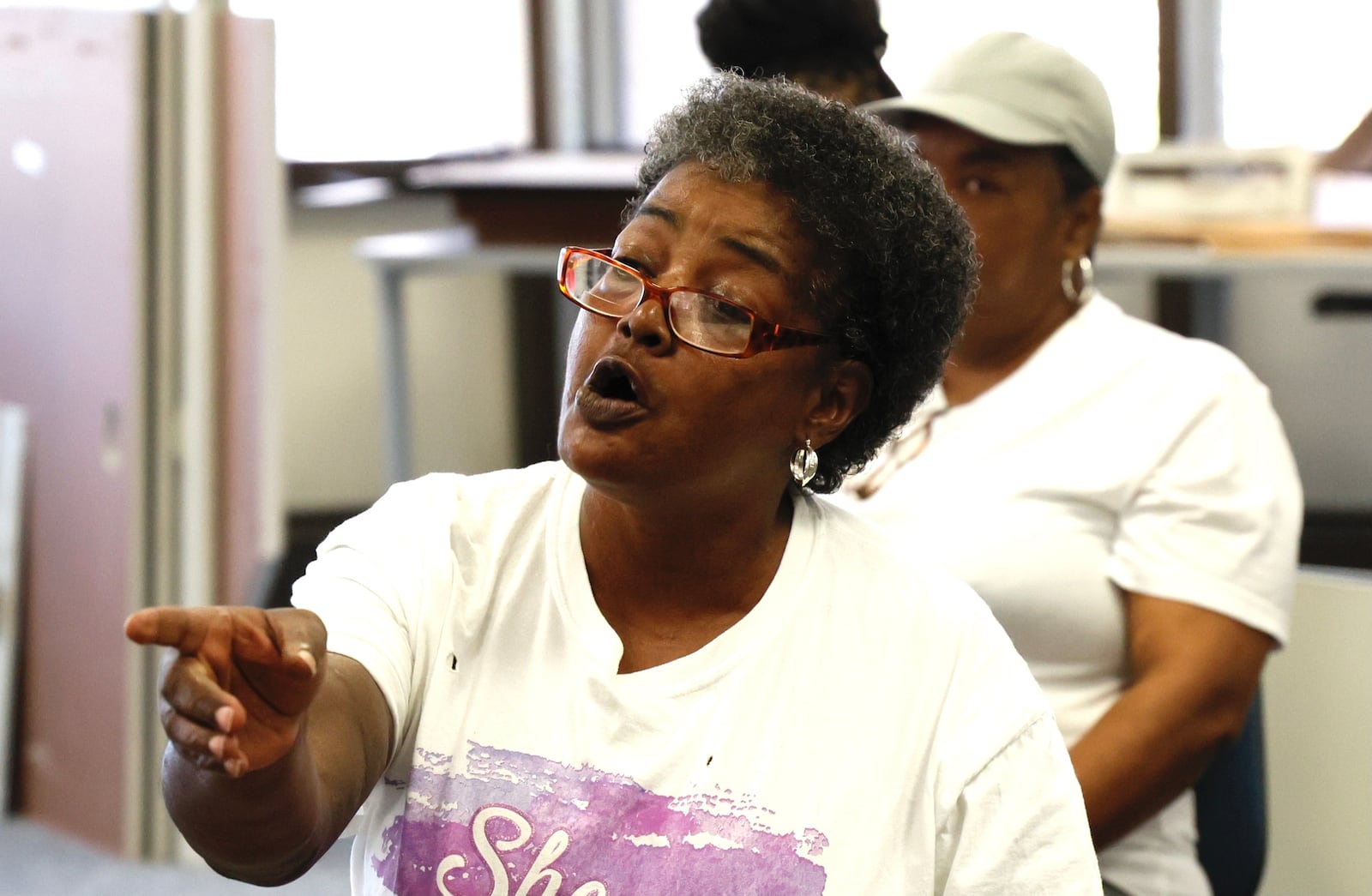 Regina Wilson, the mother of Eric Cole, asks questions during a press conference by the City of Springfield. Eric Cole, was shot Sunday night and run over by a Springfield police officer responding to the scene. BILL LACKEY / STAFF