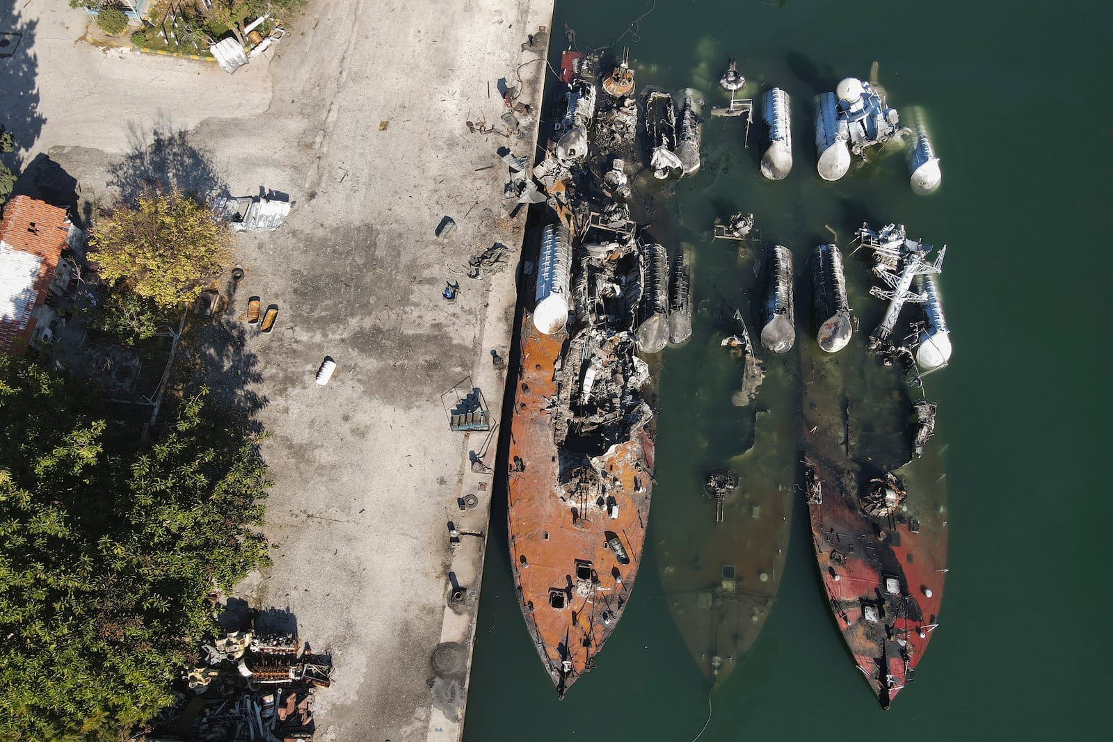 Syrian naval vessels are seen destroyed by an Israeli airstrike last week in the port of Latakia, Syria, Saturday, Dec. 14, 2024. (AP Photo/Omar Albam)