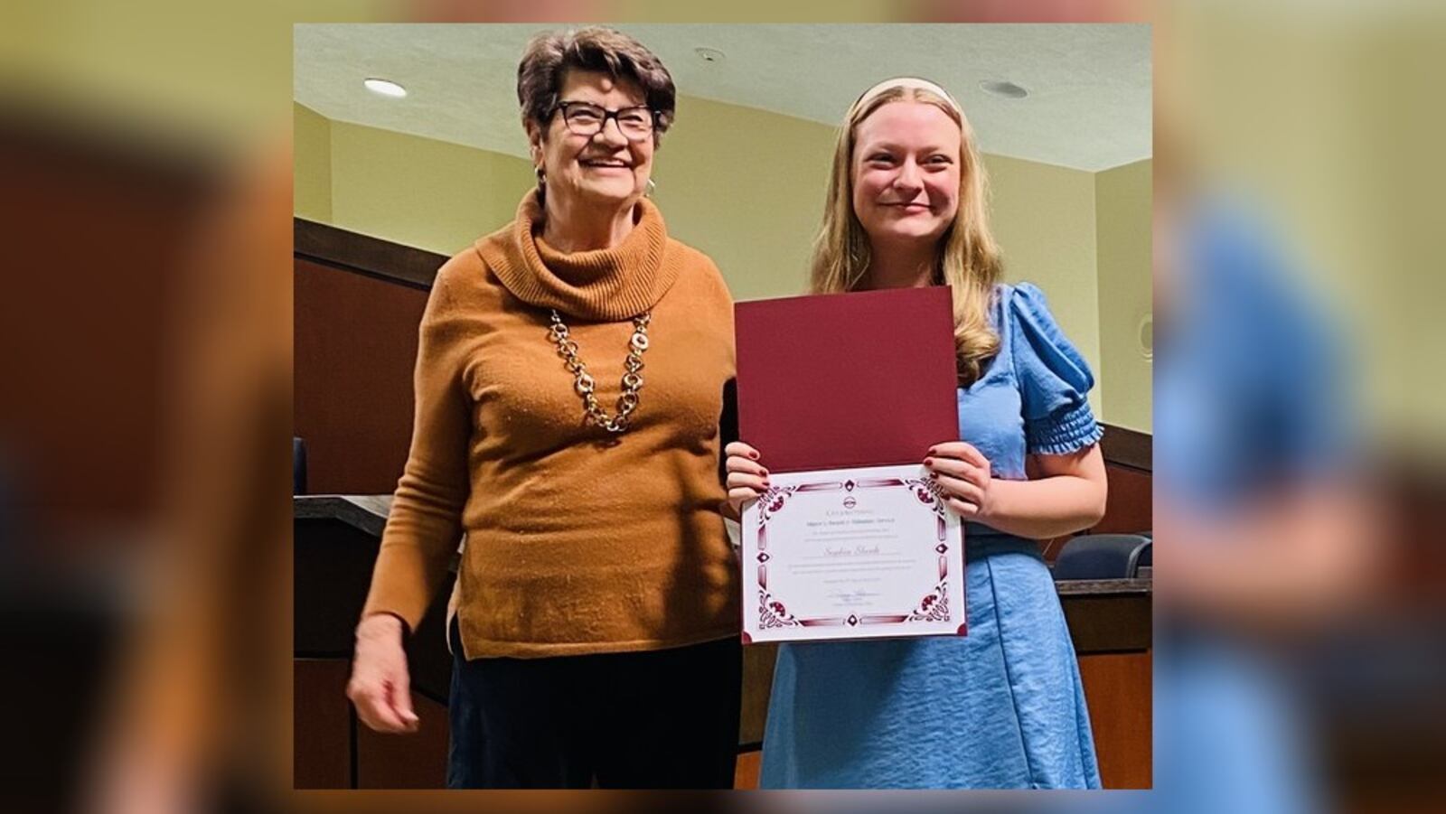 Sophia Shenk (right) was recently given the top Kettering youth award for volunteering by Mayor Peggy Lehner. Shenk is a senior at Alter High School. CONTRIBUTED