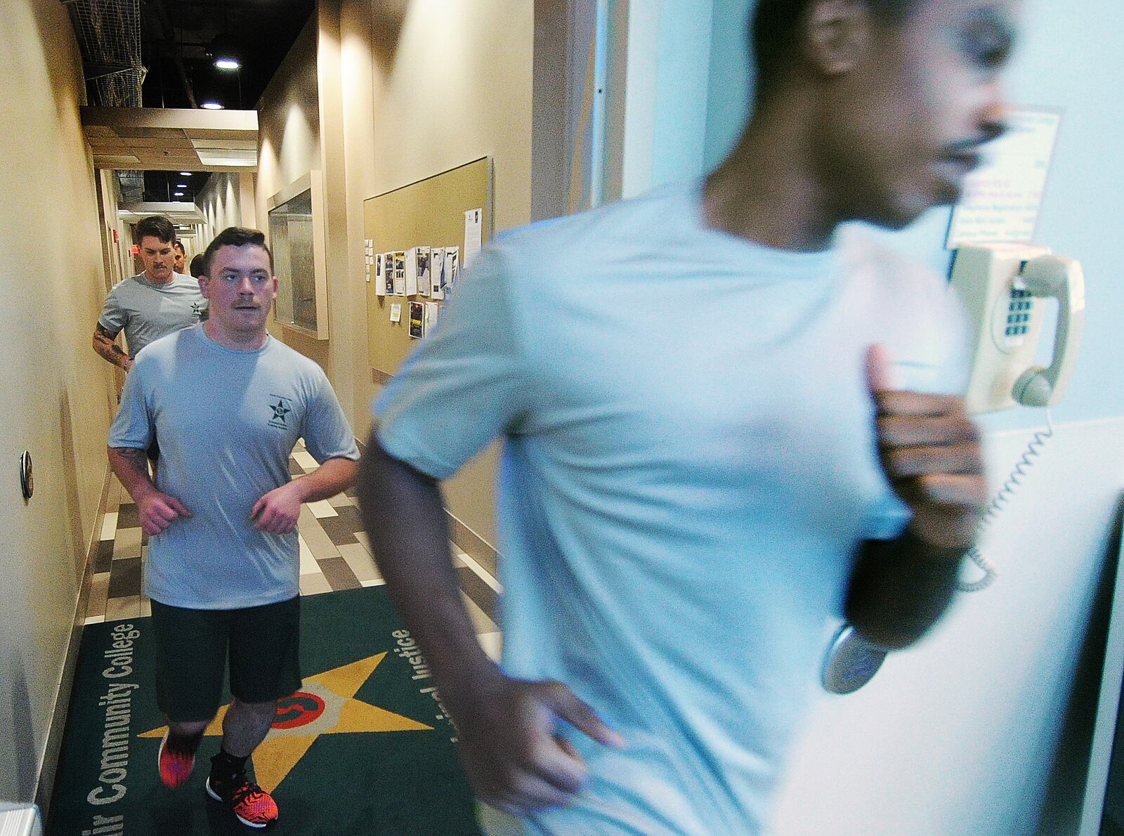 Police cadets run a circuit through the halls at Sinclair Community College, Thursday, Jan. 11, 2024. MARSHALL GORBY\STAFF