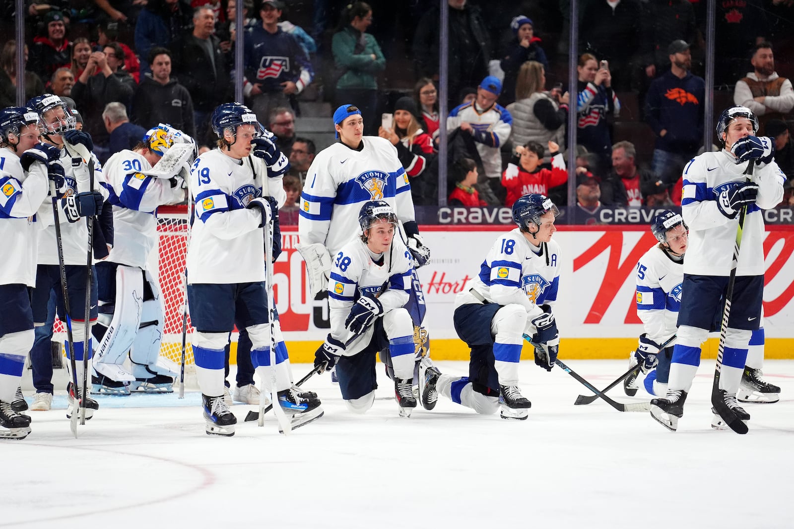 Finland players react following their overtime loss in the IIHF World Junior Hockey Championship gold medal game against the United States in Ottawa, Ontario, Sunday, Jan. 5, 2025. (Sean Kilpatrick/The Canadian Press via AP)