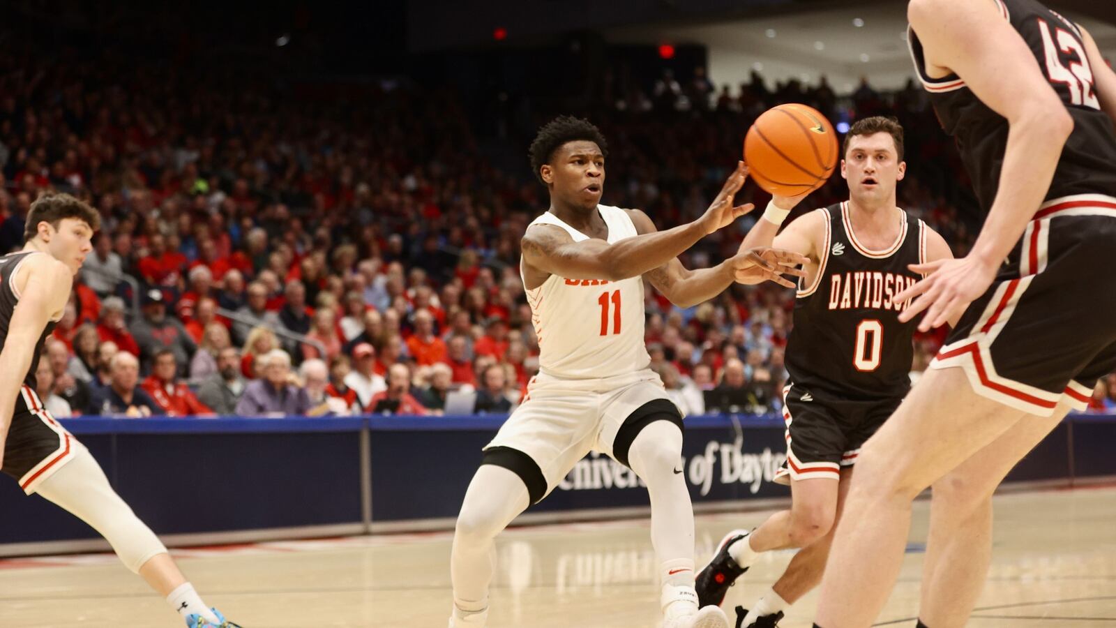 Dayton's Malachi Smith makes a pass against Davidson on Tuesday, Jan. 17, 2023, at UD Arena. David Jablonski/Staff