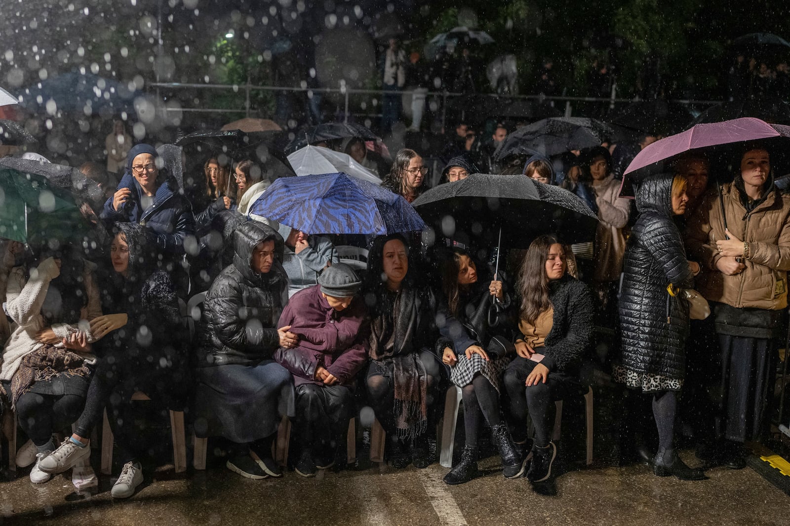 Women listen as a rabbi delivers an eulogy during a ceremony prior to the funeral of Israeli-Moldovan rabbi Zvi Kogan in Kfar Chabad, Israel, Monday Nov. 25, 2024. Kogan, 28, an ultra-Orthodox rabbi, was killed last week in Dubai where he ran a kosher grocery store. Israelis have flocked for commerce and tourism since the two countries forged diplomatic ties in the 2020 Abraham Accords.(AP Photo/Ohad Zwigenberg)