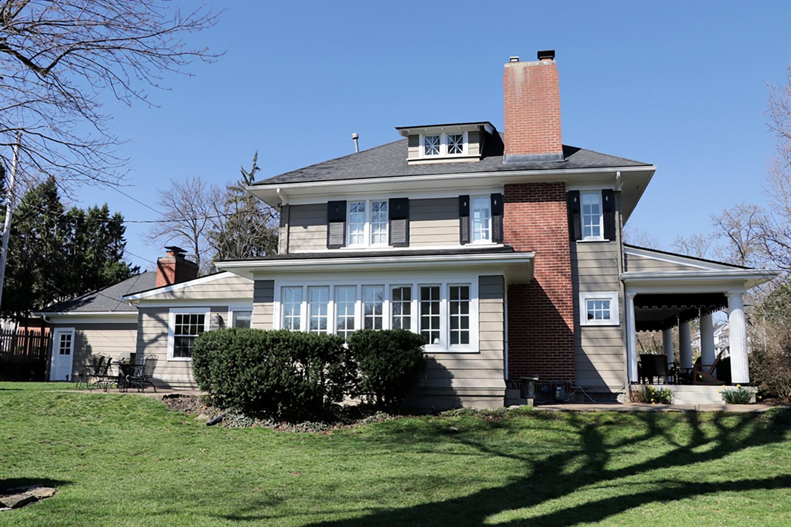 Double doors open to a sun room or possible office. Ten windows fill the room with natural light and offer panoramic views of the landscaped yard. CONTRIBUTED PHOTO BY KATHY TYLER