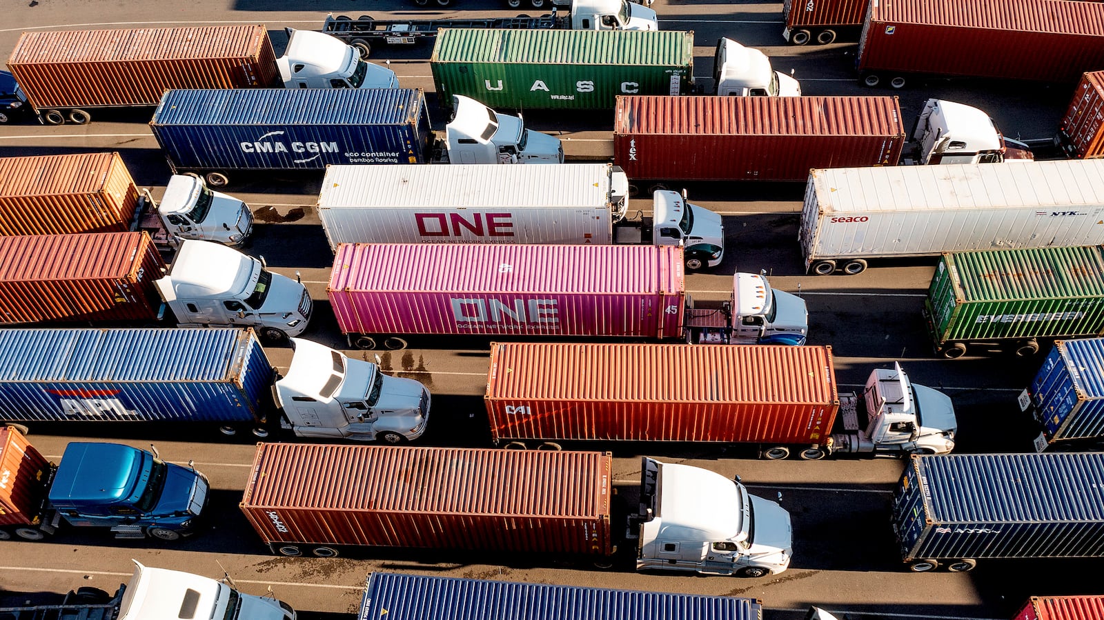 FILE - Trucks line up to enter a Port of Oakland shipping terminal on Nov. 10, 2021, in Oakland, Calif. (AP Photo/Noah Berger, File)