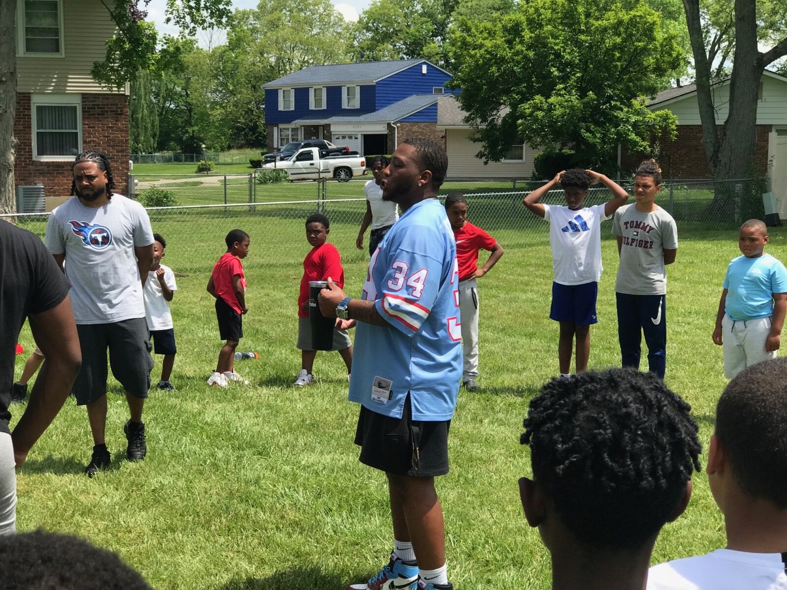 Anthony Parker Jr. (in blue 34 jersey) conducts a participatory lesson with some of the campers Thursday afternoon.  Tom Archdeacon/CONTRIBUTED