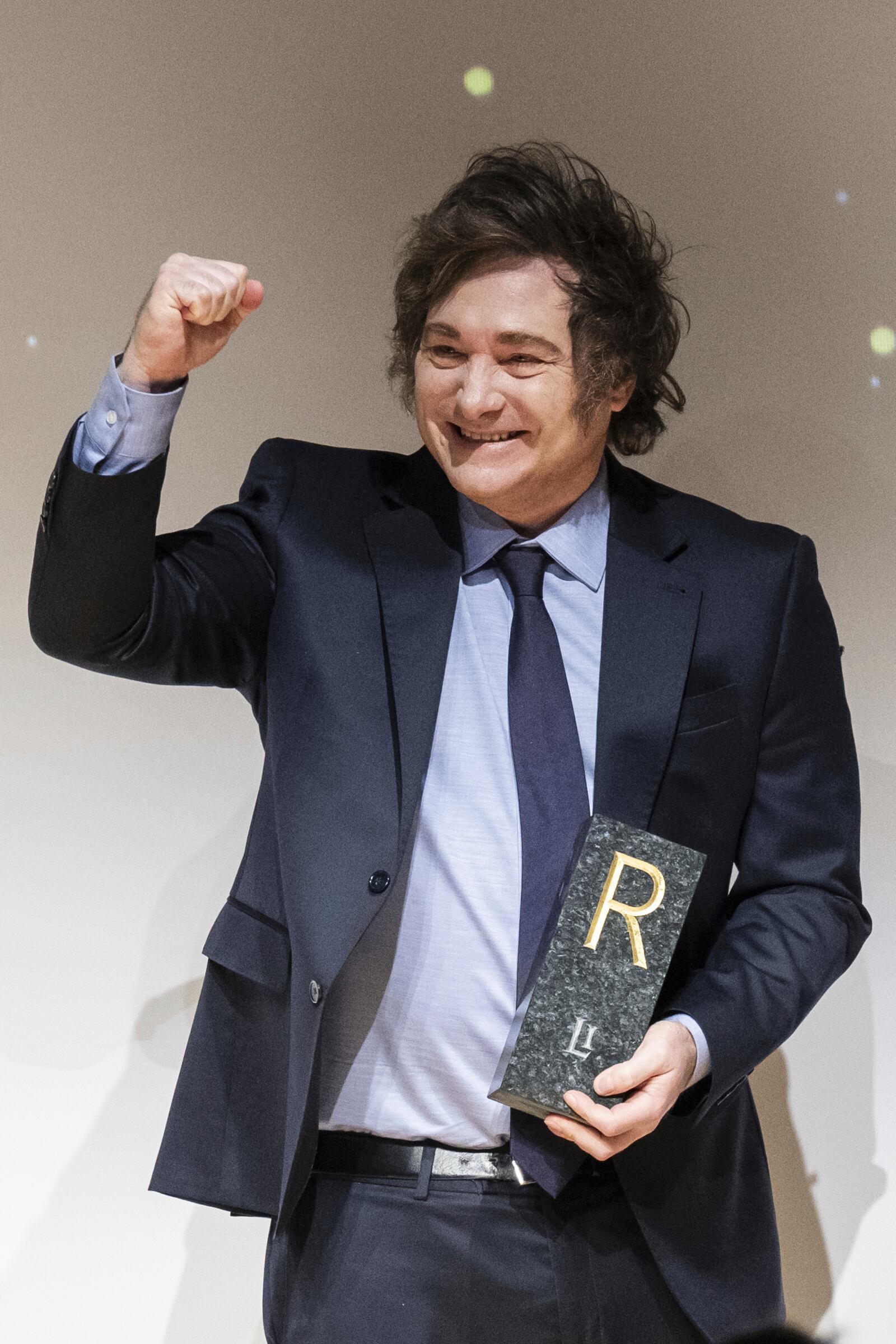 Argentina's President Javier Milei reacts after receiving this year's Roepke Prize for Civil Society of the Liberal Institute at the Congress centre in Kloten, Switzerland, Friday, Jan. 24, 2025. (Ennio Leanza/Keystone via AP)