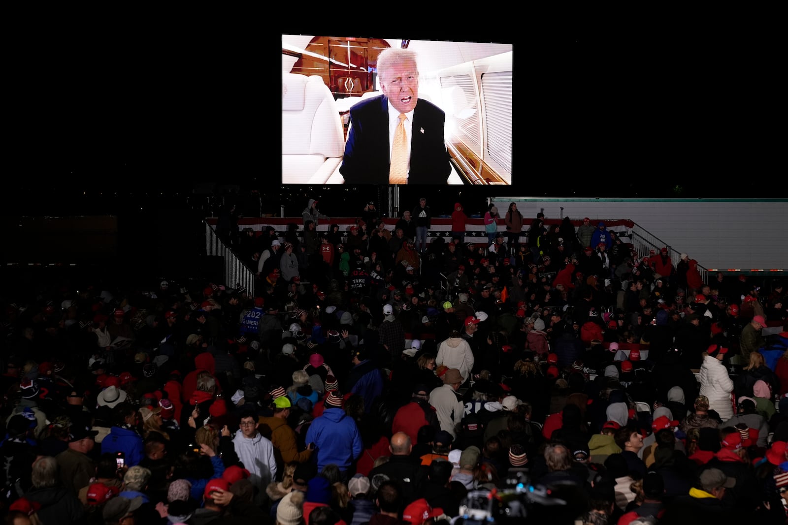 A video message from Republican presidential nominee former President Donald Trump is played at a campaign event Friday, Oct. 25, 2024, in Traverse City, Mich. (AP Photo/Paul Sancya)