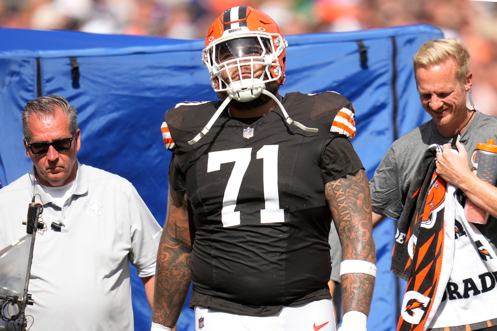 Cleveland Browns' Jedrick Wills Jr. leaves the game following an injury in the second half of an NFL football game against the New York Giants, Sunday, Sept. 22, 2024, in Cleveland. (AP Photo/Sue Ogrocki)