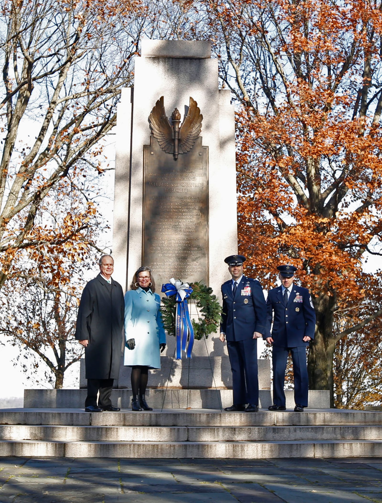 Wright Family descendants Stephen Wright and Amanda Wright Lane with Col. Thomas P. Sherman, Commander, Wright-Patterson Air Force Base and CMSGT Stephen A. Arbona, Command Master Cheif at the 115th Anniversary of powered flight on Wright Memorial Hill. TY GREENLEES / STAFF