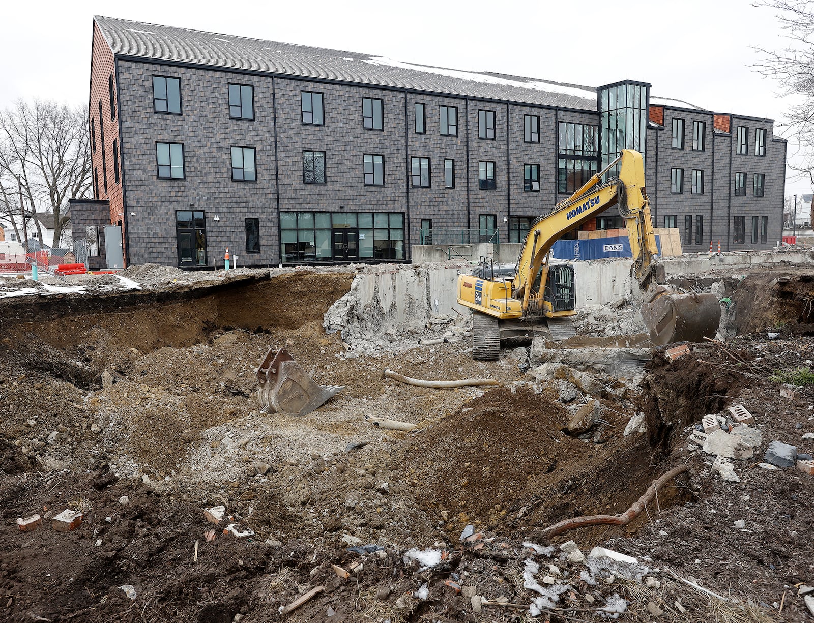 Ronald McDonald House Charities Dayton demolishes its former building after nearing the completion of construction on its new facility, which triples the amount of space it had to house families it had in its old building. The demolition began Feb. 11, 2025. MARSHALL GORBY\STAFF