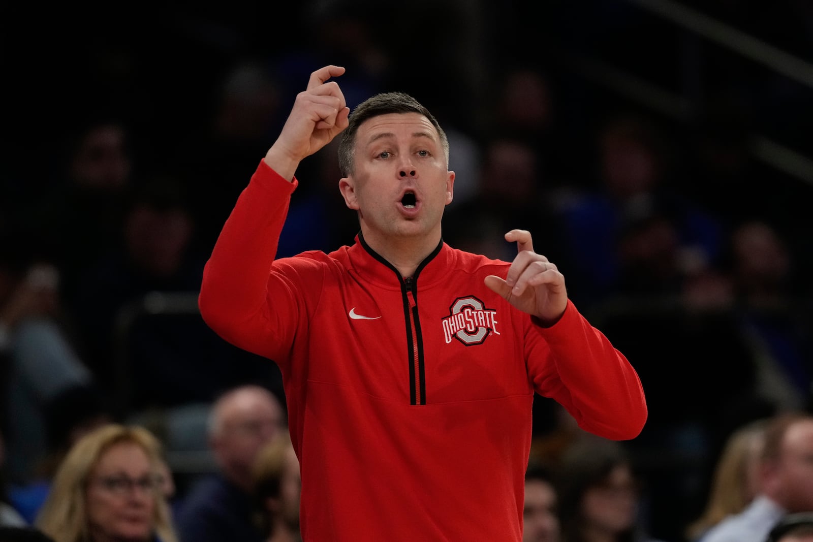 Ohio State head coach Jake Diebler calls out to his team during the second half of an NCAA college basketball game against Kentucky in the CBS Sports Classic, Saturday, Dec. 21, 2024, in New York. (AP Photo/Frank Franklin II)