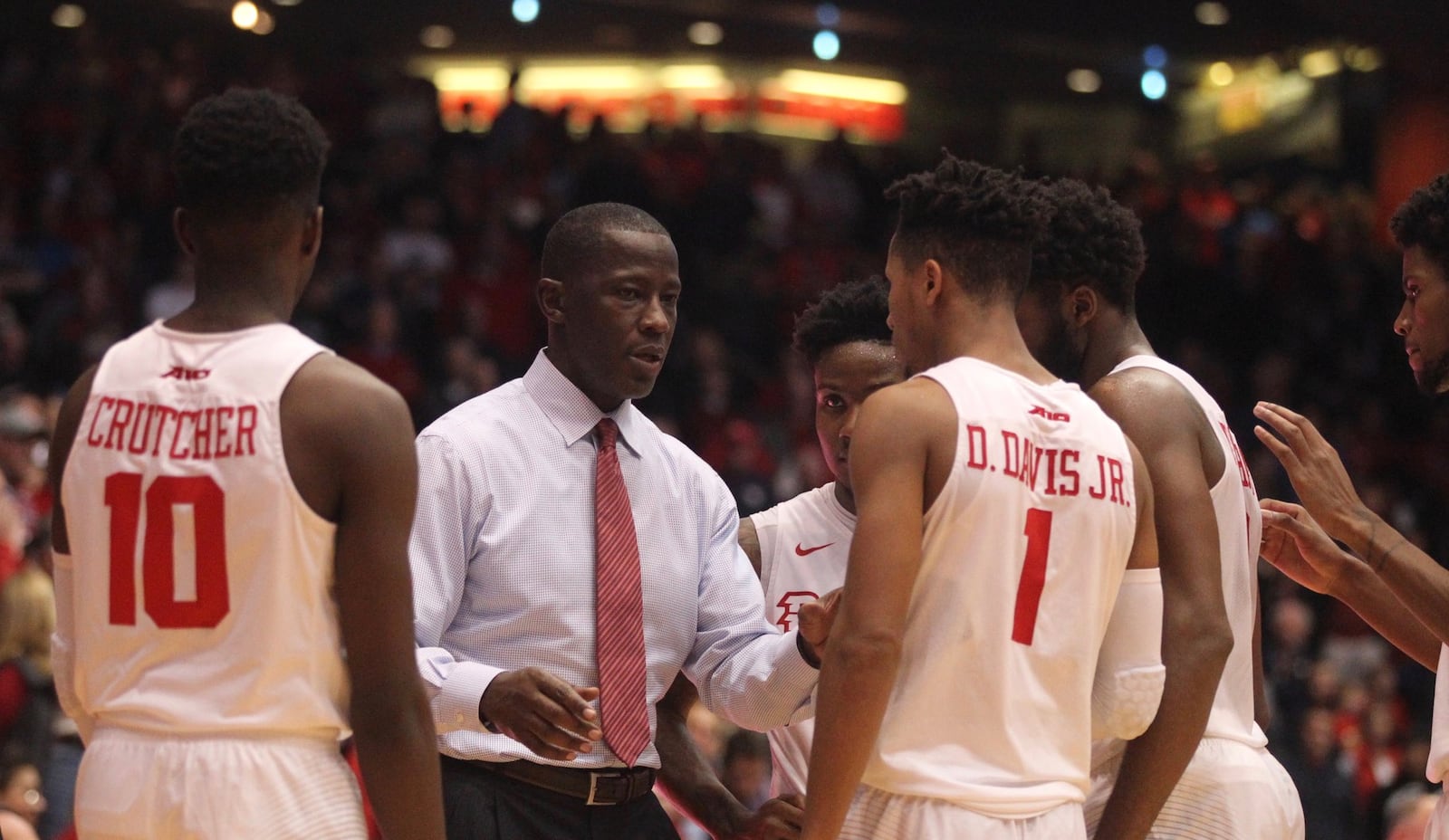 Dayton’s Anthony Grant talks to his players before the final shot against Ball State on Friday, Nov. 10, 2017, at UD Arena. David Jablonski/Staff