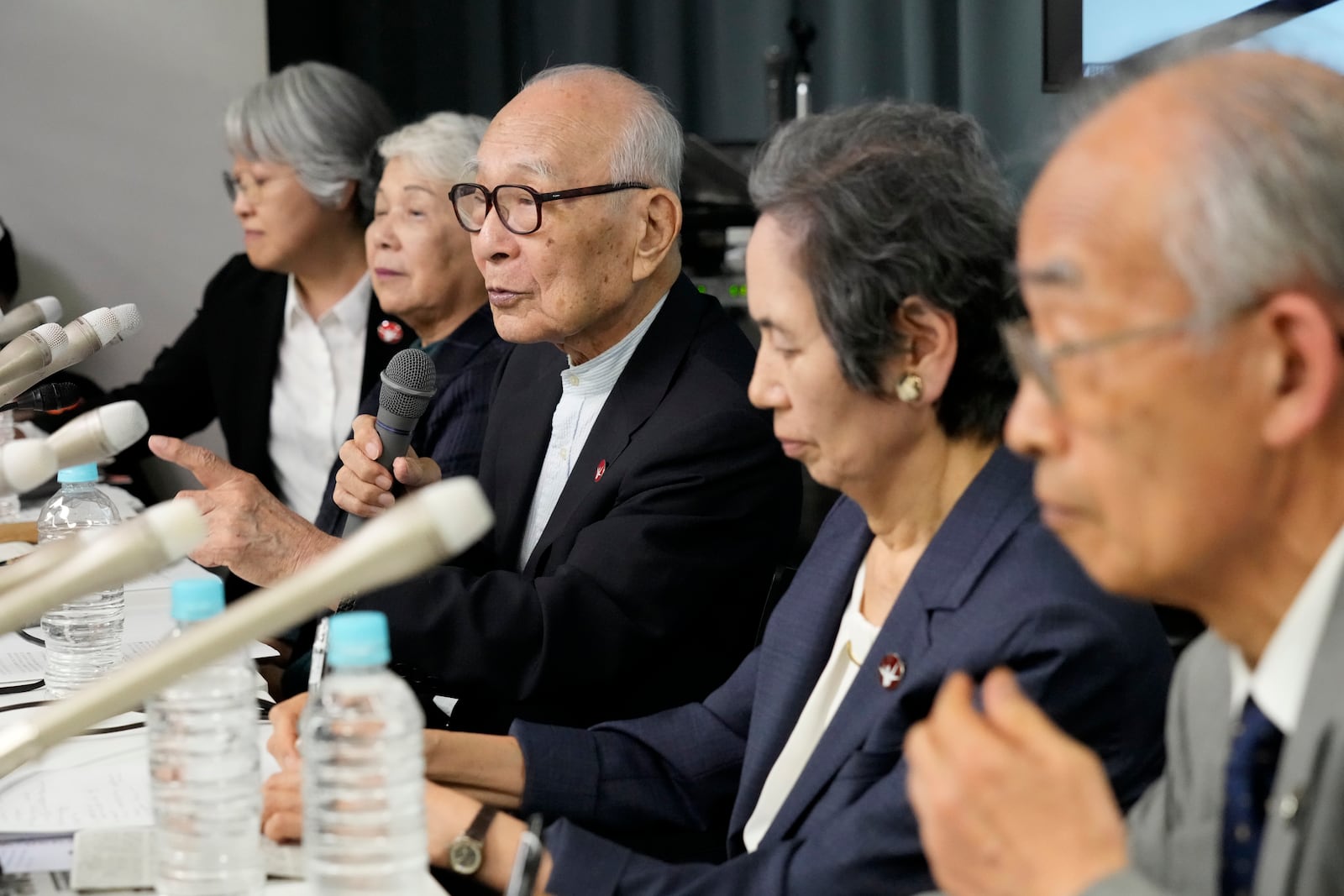 Terumi Tanaka, center, co-chairperson of Nihon Hidankyo speaks during a press conference in Tokyo, Saturday, Oct. 12, 2024, a day after Nihon Hidankyo, an organization of survivors of the two U.S. atomic bombings, won the Nobel Peace Prize. (AP Photo/Hiro Komae)