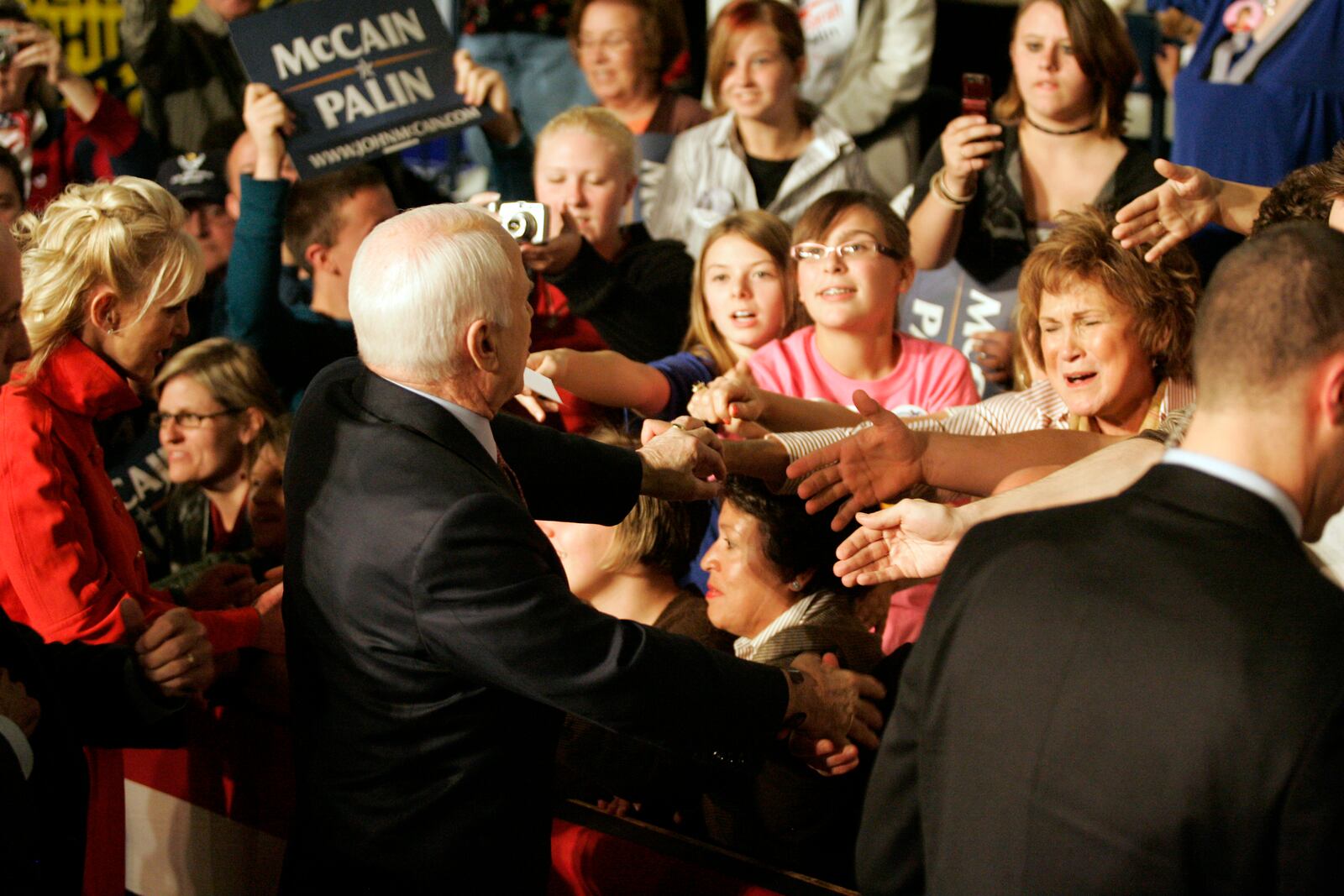 GOP Senator and presidential candidate John McCain and wife Cindy shake hands with the audience in Kettering's Trent Arena during his visit to Dayton today 10/27/08.