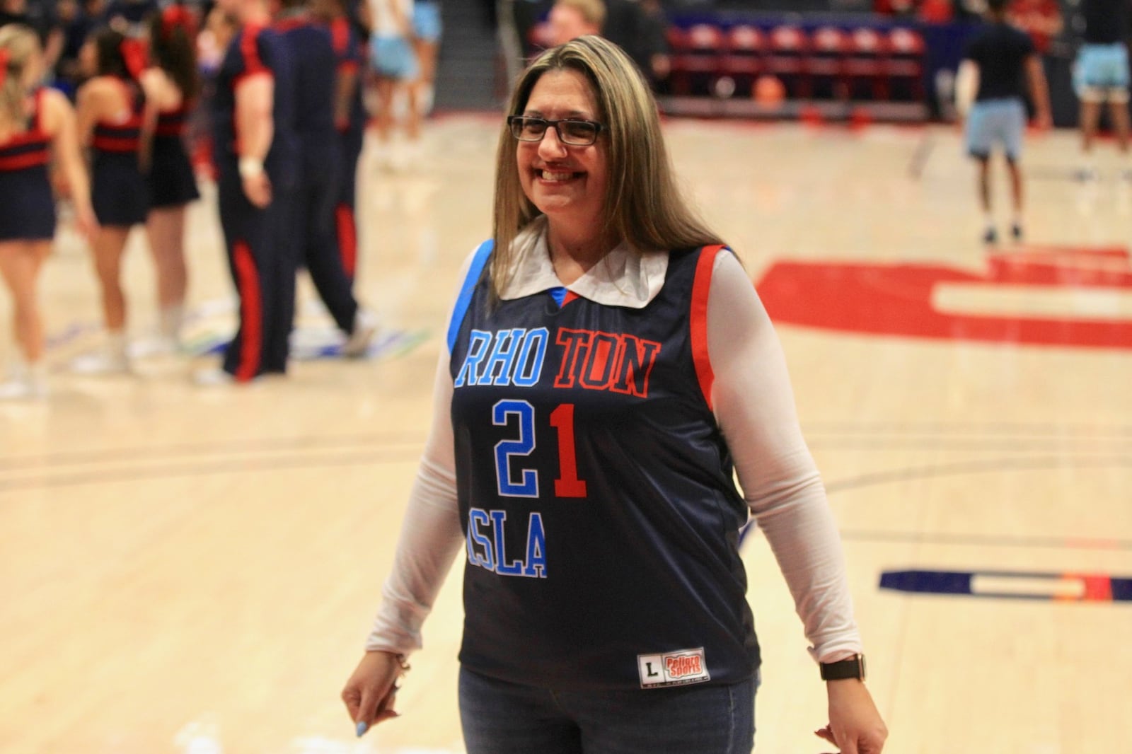 Roni Toppin, the mother of Obi and Jacob Toppin, wore a ‘split team’ jersey during the Dayton-Rhode Island game on Tuesday, Feb. 11, 2020, at UD Arena. David Jablonski/Staff