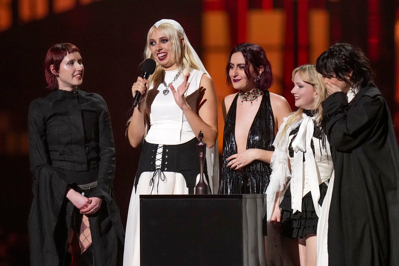 Lizzie Mayland, from left, Georgia Davies, Aurora Nishevci, Emily Roberts and Abigail Morris, from the group 'The Last Dinner Party', accept the best new artist award during the Brit Awards 2025 in London, Saturday, March.1, 2025. (Photo by Scott A Garfitt/Invision/AP)