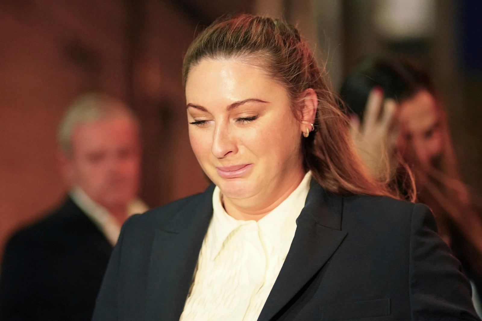 Nikita Hand, who is also known as Nikita Ni Laimhin, leaves the High Court in Dublin, Ireland, Friday, Nov. 22, 2024, after a civil jury found that mixed martial arts fighter Conor McGregor sexually assaulted her in a hotel penthouse after a night of heavy partying. (Brian Lawless/PA via AP)