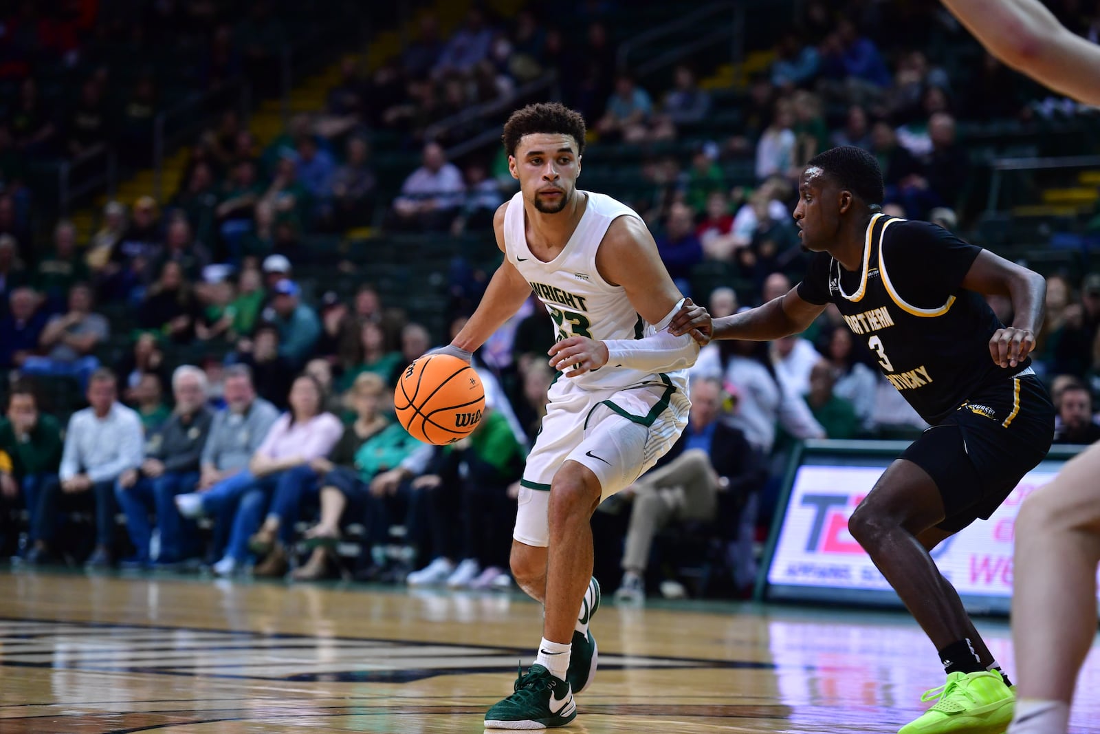 Wright State's Tanner Holden is guarded by NKU's Marques Warrick during Thursday's Horizon League quarterfinal game at the Nutter Center. Joe Craven/Wright State Athletics