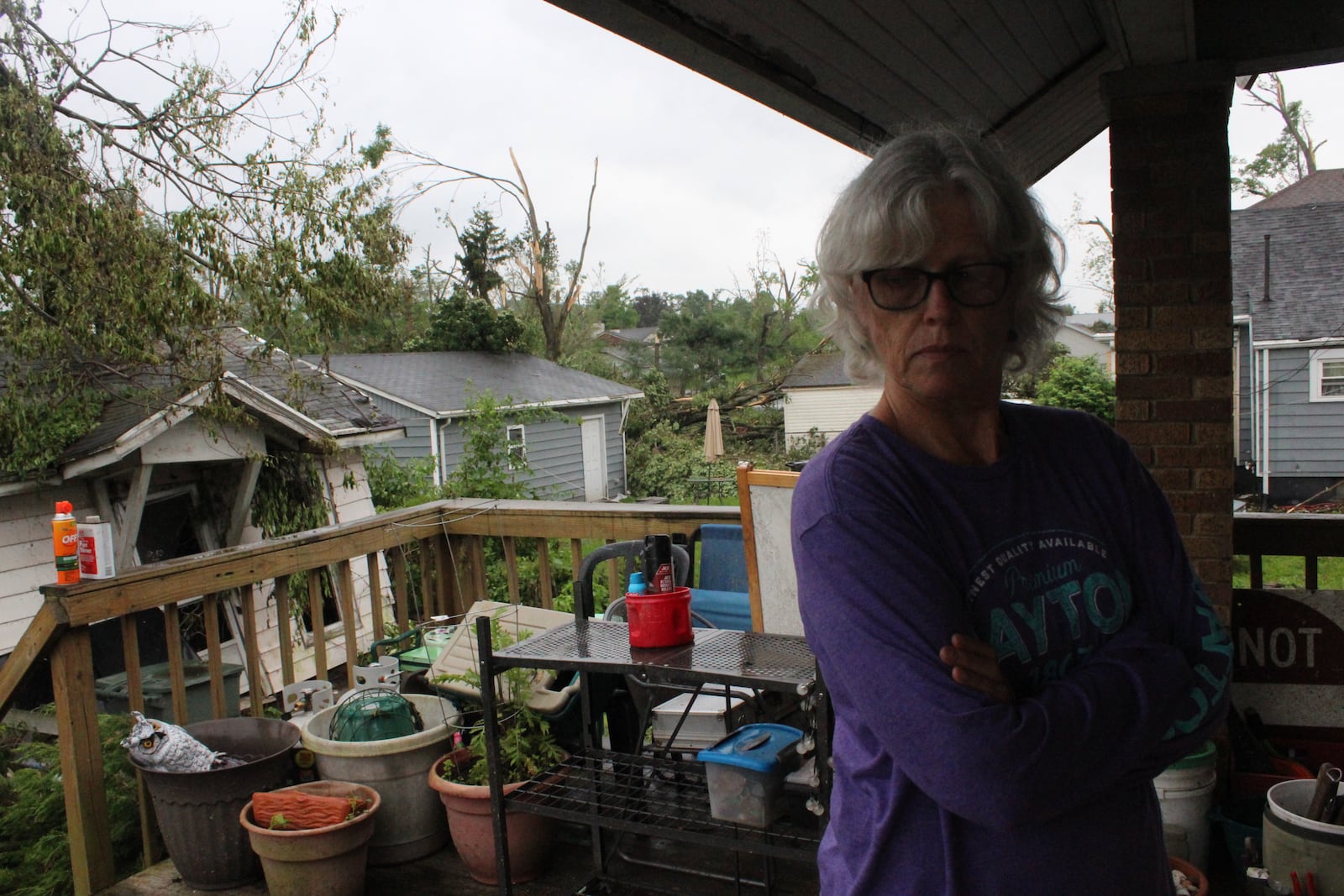 Robin Sassenberg of Dayton. Friends and volunteers from Oregon District business helped the couple remove debris and secure their Hilldale Avenue home in the wake of the Memorial Day tornadoes.  Photos by Amelia Robinson