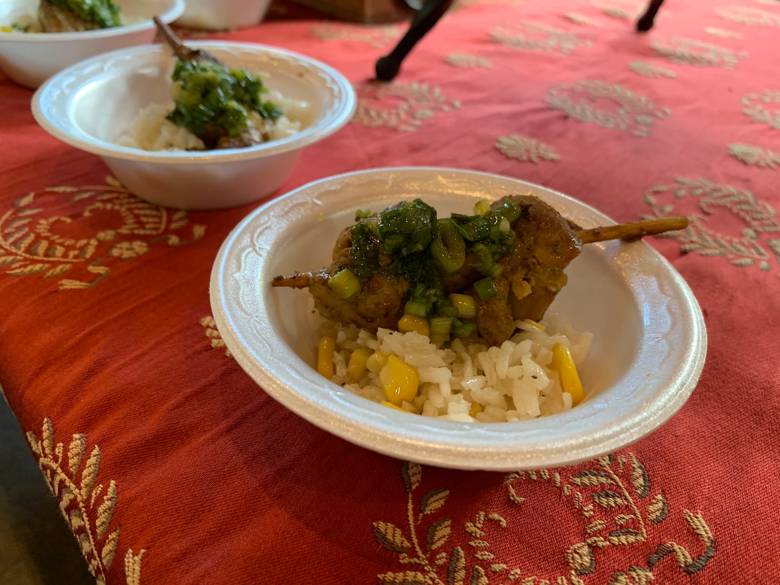 Salar Restaurant and Lounge's Shoyu and cilantro marinated grilled chicken skewers, green onion, and Aji Amarillo Salsa, corn and jasmine rice. CONTRIBUTED PHOTO BY ALEXIS LARSEN