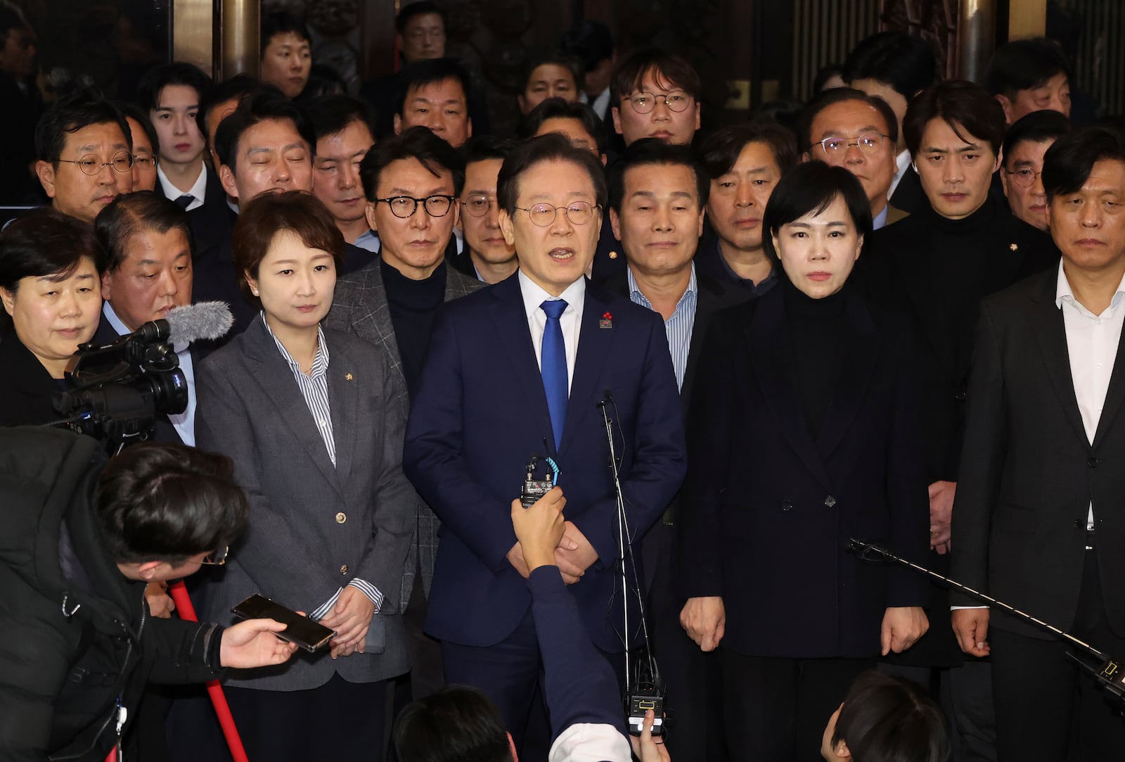 South Korea's main opposition Democratic Party leader Lee Jae-myung, center, speaks at the National Assembly in Seoul, South Korea, Wednesday, Dec. 4, 2024. (Kim Ju-hyung/Yonhap via AP)