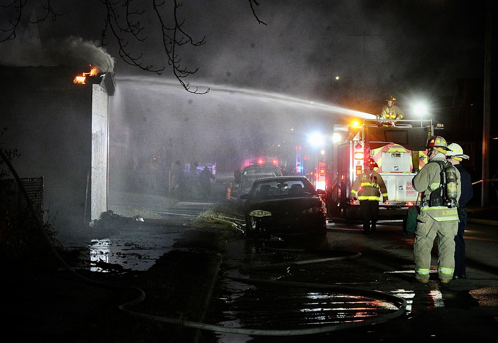 Fire destroyed a vacant house, the house next door and damaged a third house Monday evening, Nov. 7, 2022, in the 200 block of Alaska Street in Dayton. MARSHALL GORBY/STAFF