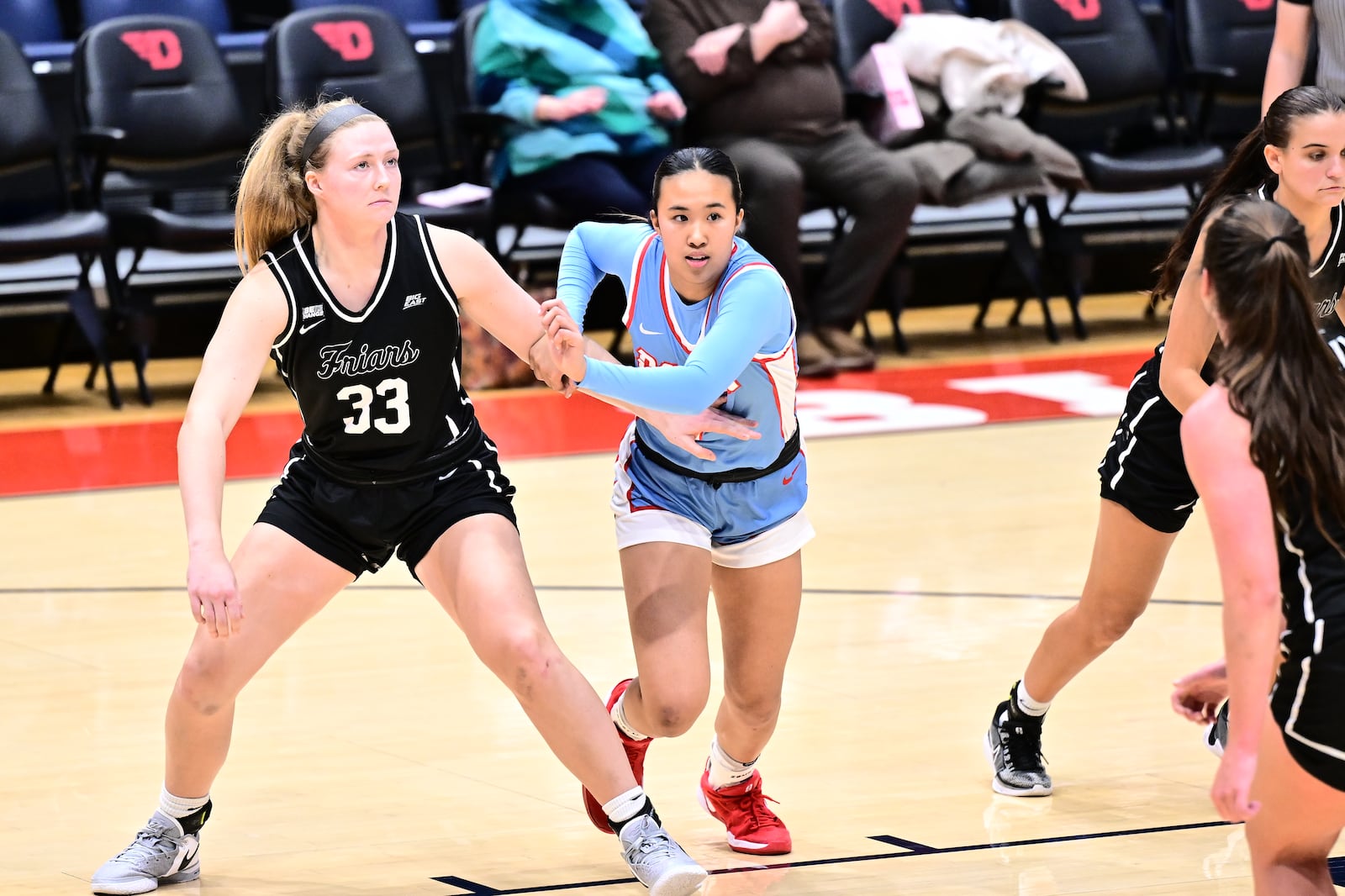 Dayton's Olivia Leung battles Providence's Emily Archibald for a rebound during Thursday's game at UD Arena. Erik Schelkun/UD Athletics