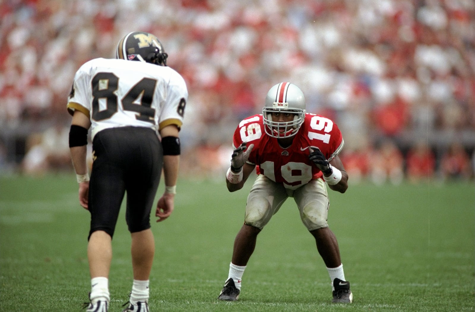 19 Sep 1998:  Cornerback Ahmed Plummer #19 of the Ohio State Buckeyes in action against wide receiver Kent Layman #84 of the Missouri Tigers during the game at the Ohio Stadium in Columbus, Ohio. The Buckeyes defeated the Tigers 35-14. Mandatory Credit: M