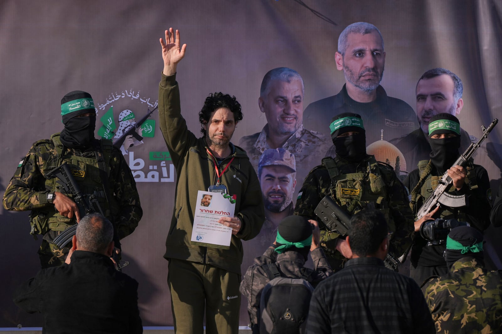 Israeli Ofer Kalderon who has been held hostage by Hamas in Gaza since October 7, 2023, waves before being handed over to the Red Cross by Hamas fighters in Khan Younis, southern Gaza Strip, Saturday Feb. 1, 2025. Photo/Abdel Kareem)