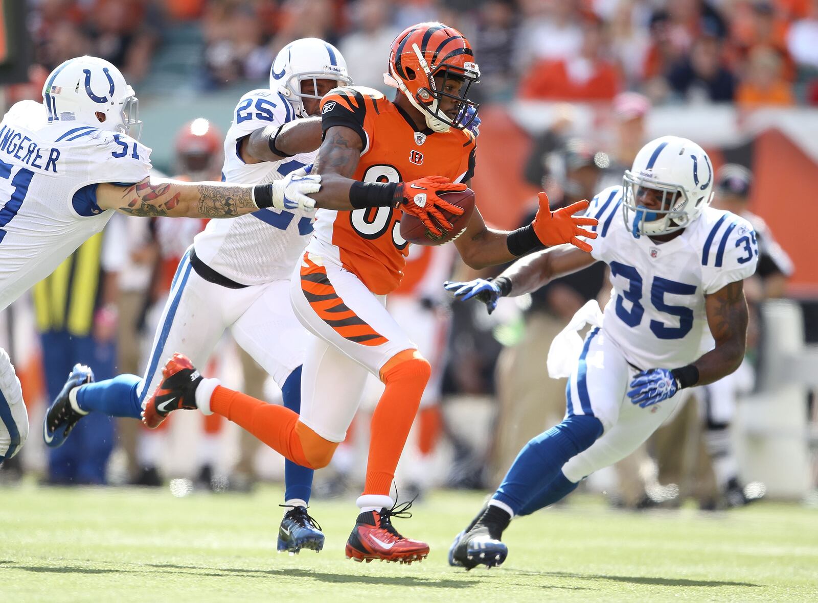 CINCINNATI, OH - OCTOBER 16: Jerome Simpson #89 of the Cincinnati Bengals runs with the ball during the NFL game against the Indianapolis Colts at Paul Brown Stadium on October 16, 2011 in Cincinnati, Ohio. The Bengals won 27-17.  (Photo by Andy Lyons/Getty Images)