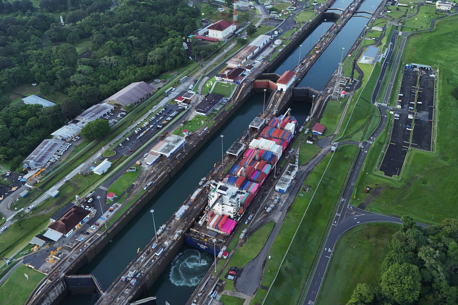 A cargo ship traverses the Agua Clara Locks of the Panama Canal in Colon, Panama, Monday, Sept. 2, 2024. (AP Photo/Matias Delacroix)