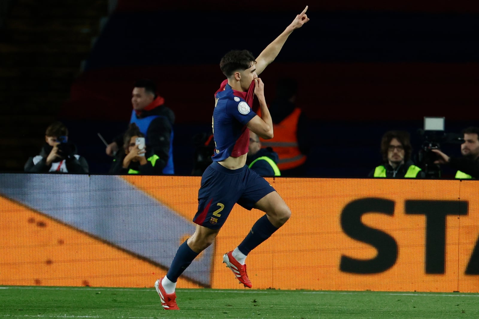 Barcelona's Pau Cubarsi celebrates after a goal during a Spanish Copa del Rey, or King's Cup, the semi-final soccer match between Barcelona and Atletico Madrid in Barcelona, Spain, Tuesday, Feb. 25, 2025. AP Photo/Joan Monfort)