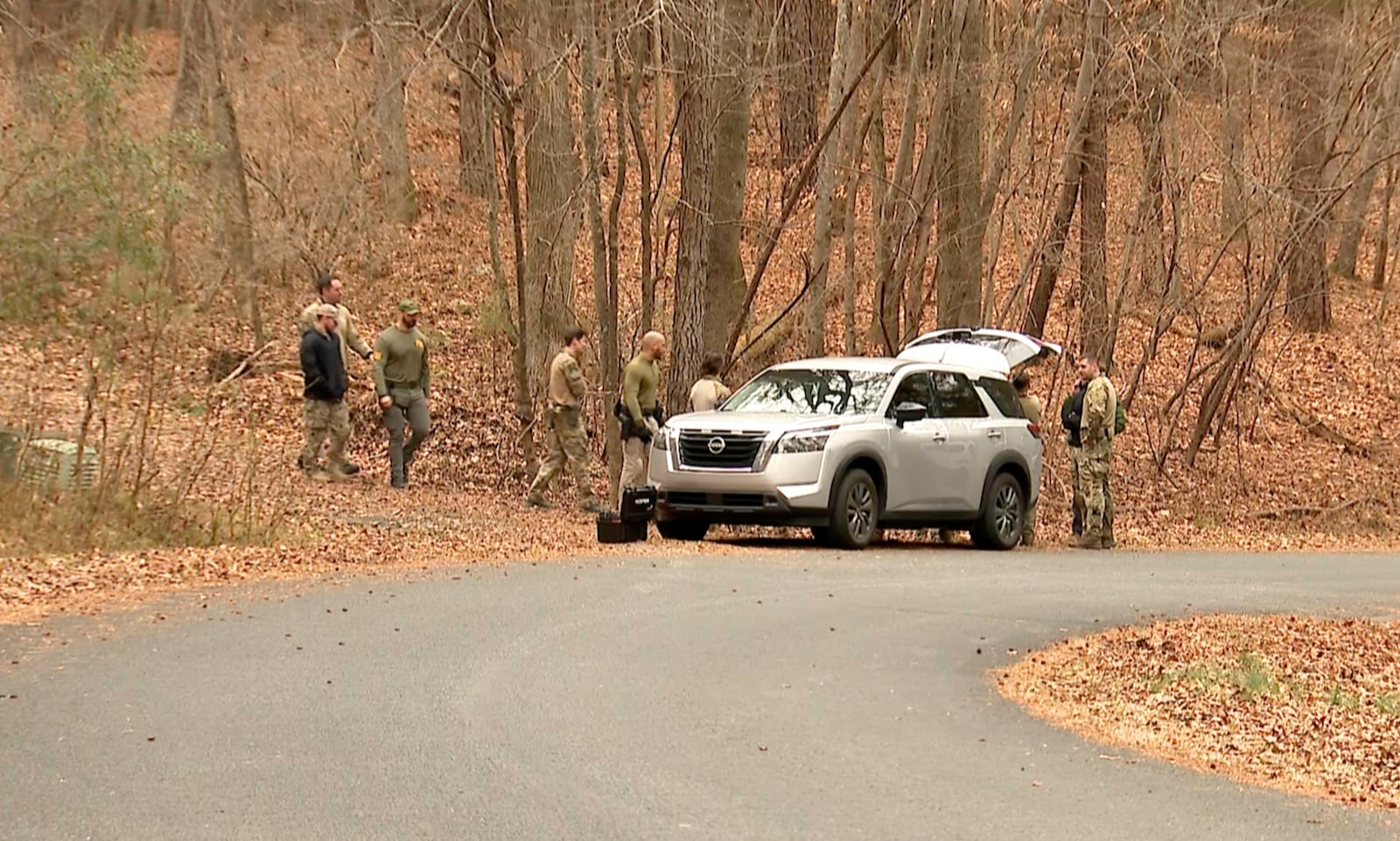 FBI agents search a neighborhood in Chapel Hill, North Carolina on Wednesday, Feb. 5, 2025, where Teresa Youngblut and Felix Bauckholt, who were involved in the shooting death of a U.S. Border Patrol agent in Vermont, had been renting homes in the neighborhood, their landlord told The Associated Press. (WRAL-TV via AP)