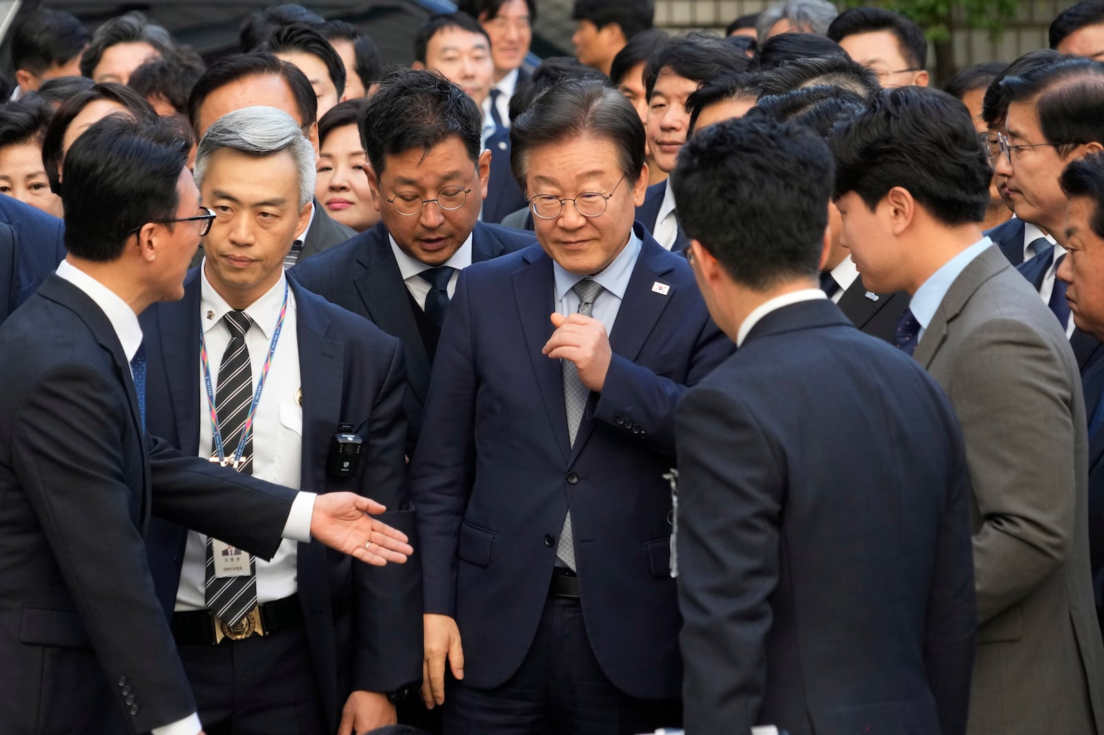 South Korea's main opposition Democratic Party leader Lee Jae-myung, center, arrives at the Seoul Central District Court in Seoul, South Korea, Friday, Nov. 15 2024. (AP Photo/Ahn Young-joon)