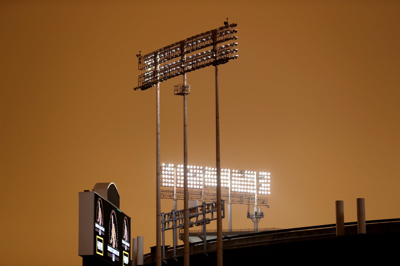 RingCentral Coliseum stands under skies darkened by wildfire smoke before the Oakland Athletics' baseball game against the Houston Astros in Oakland, Calif., Wednesday, Sept. 9, 2020. (AP Photo/Jed Jacobsohn)