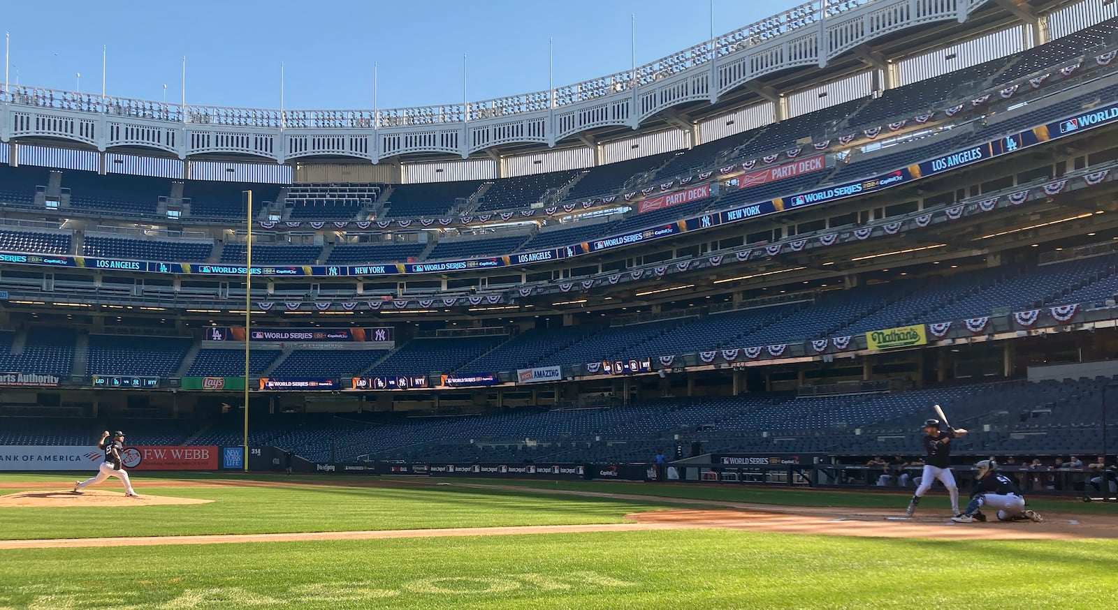 New York Yankees' Nester Cortes throws batting practice to Yankees' Austin Wells, Tuesday, Oct. 22, 2024. (AP Photo/Rom Blum)