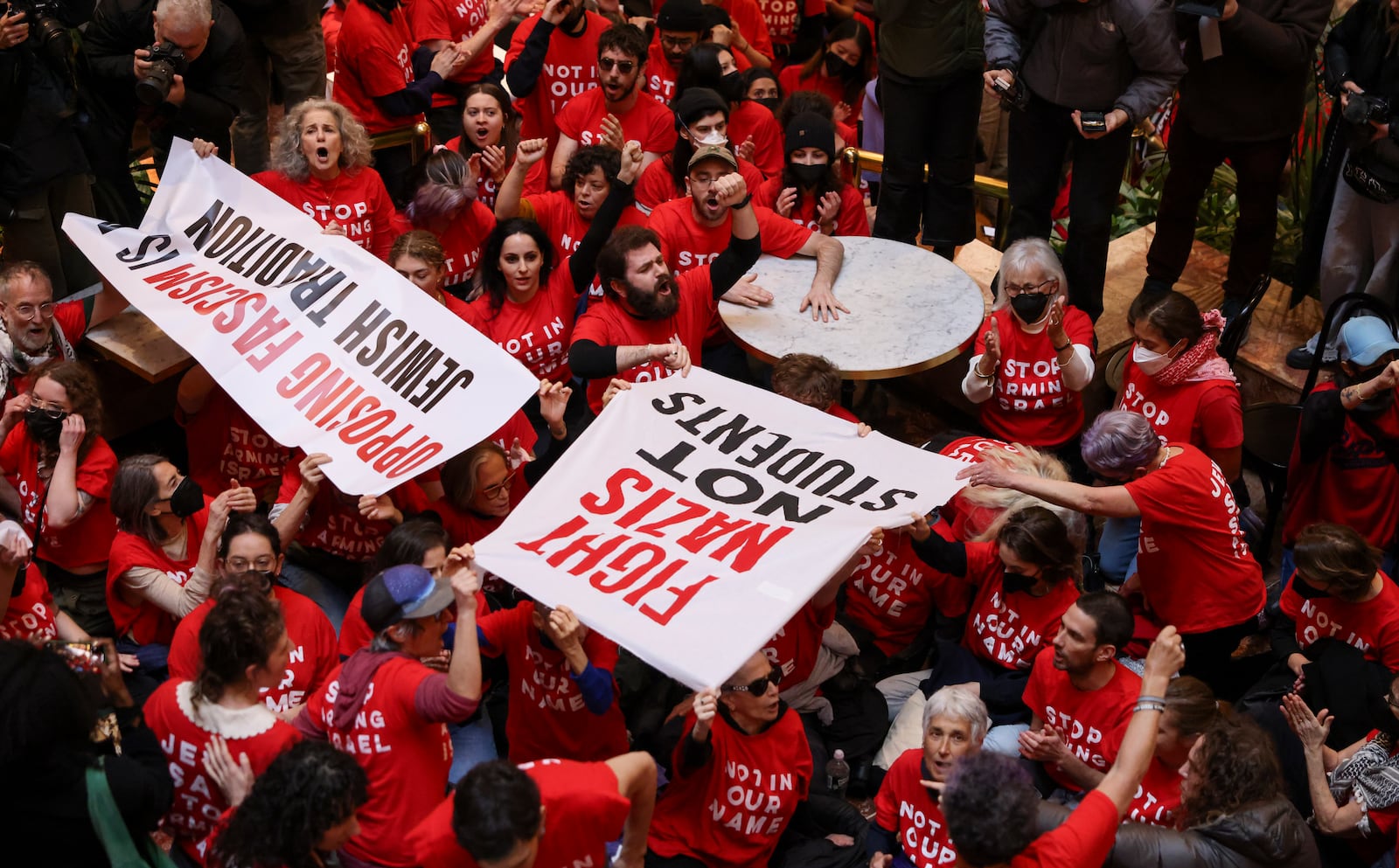 Demonstrators with the group, Jewish Voice for Peace, protest inside Trump Tower in support of Columbia graduate student Mahmoud Khalil, Thursday, March 13, 2025, in New York. (AP Photo/Yuki Iwamura)