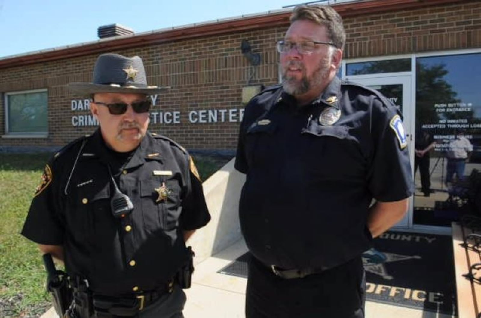 Darke County Sheriff Mark Whittaker and Greenville Police Chief Eric Roberts speak to the media on Aug. 23, 2022, about an investigation that led to the discovery of a missing man's body in a shallow grave at a commercial poultry farm. MARSHALL GORBY\STAFF