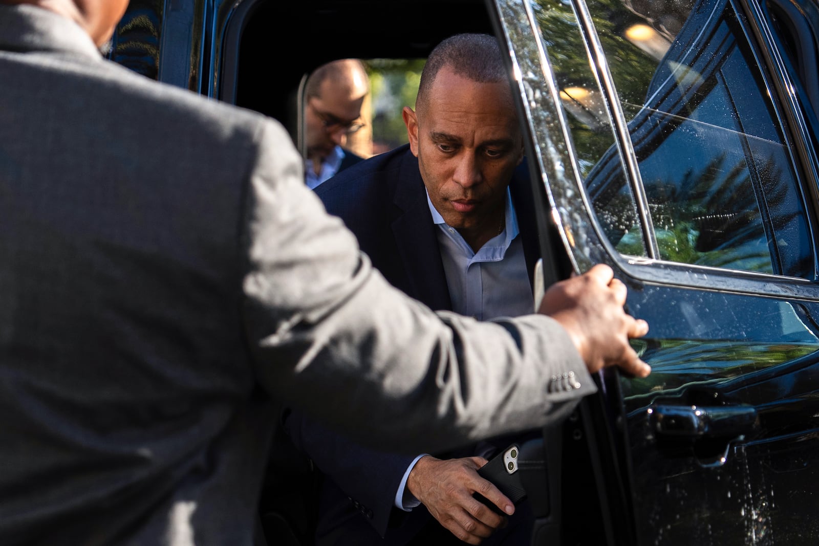 House Minority Leader Hakeem Jeffries, D-N.Y., center, arrives for an interview with The Associated Press, Saturday, Oct. 12, 2024, in Irvine, Calif. (AP Photo/Julia Demaree Nikhinson)