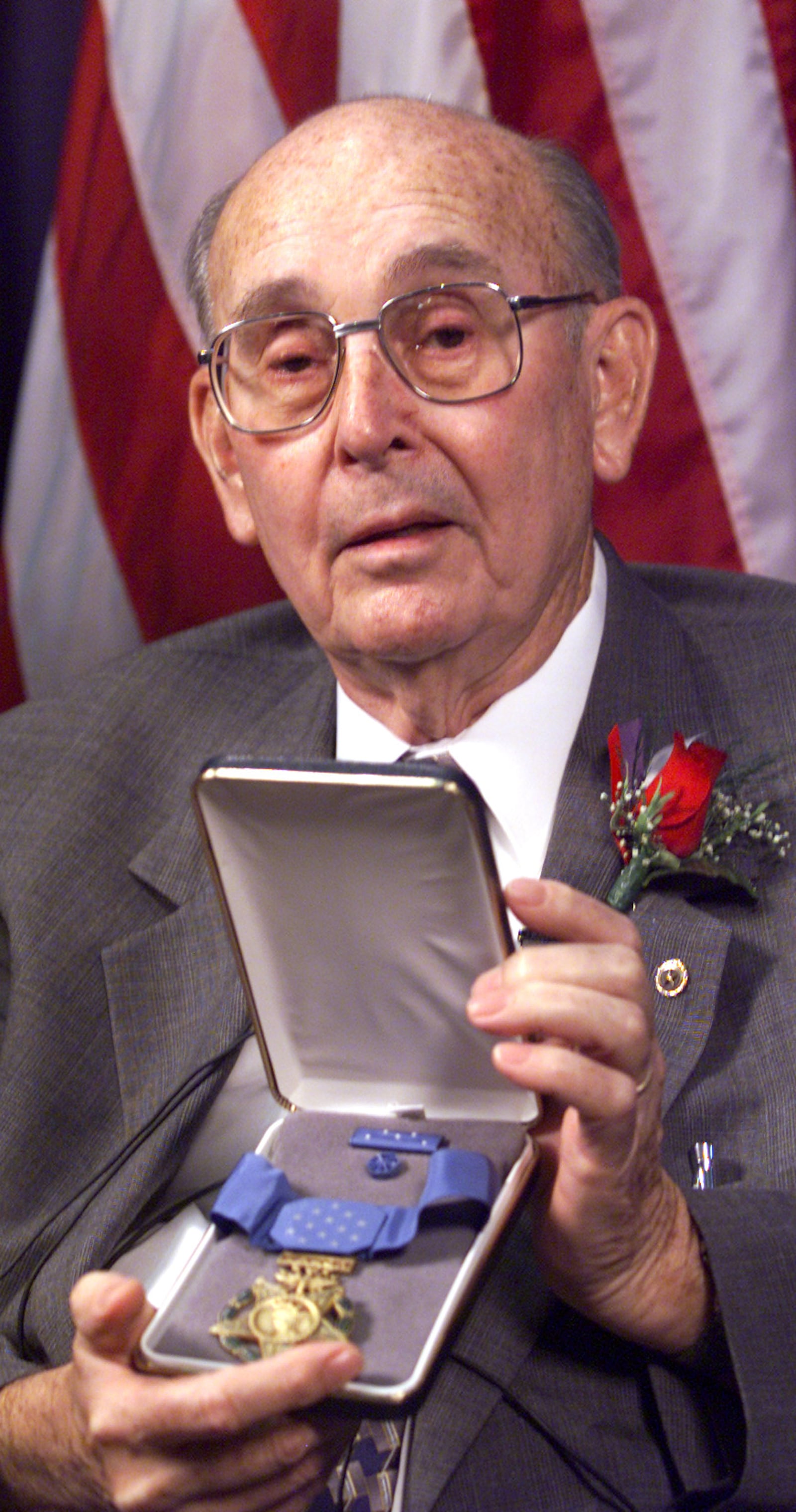 In this 2000 photo, William F. “Frank” Pitsenbarger shows the Congressional Medal of Honor he received posthumously for his son Airman1st Class William H. Pitsenbarger, a pararescuer who was killed during the Vietnam War. FILE PHOTO