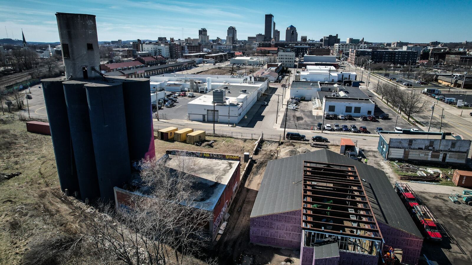 Wes Hartshorn and his two friends/business partners, Shannon Thomas and Scott Johnson, are in the midst of redeveloping 1.5 acres near 2nd Street Market in downtown Dayton into The Silos, a food hall and beer garden with 13,000-square-feet of outdoor space. JIM NOELKER/STAFF