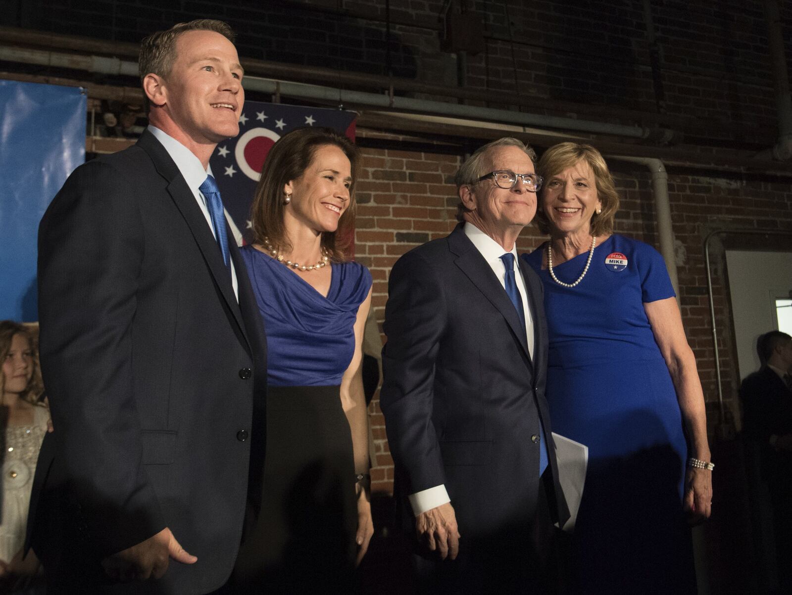 Jon Husted, Republican candidate for Lieutenant Governor, from left, his wife Tina, stand with Republican gubernatorial candidate Mike DeWine and his wife Fran at an a primary election night rally, Tuesday, May 8, 2018, in Columbus, Ohio. (AP Photo/Bryan Woolston)