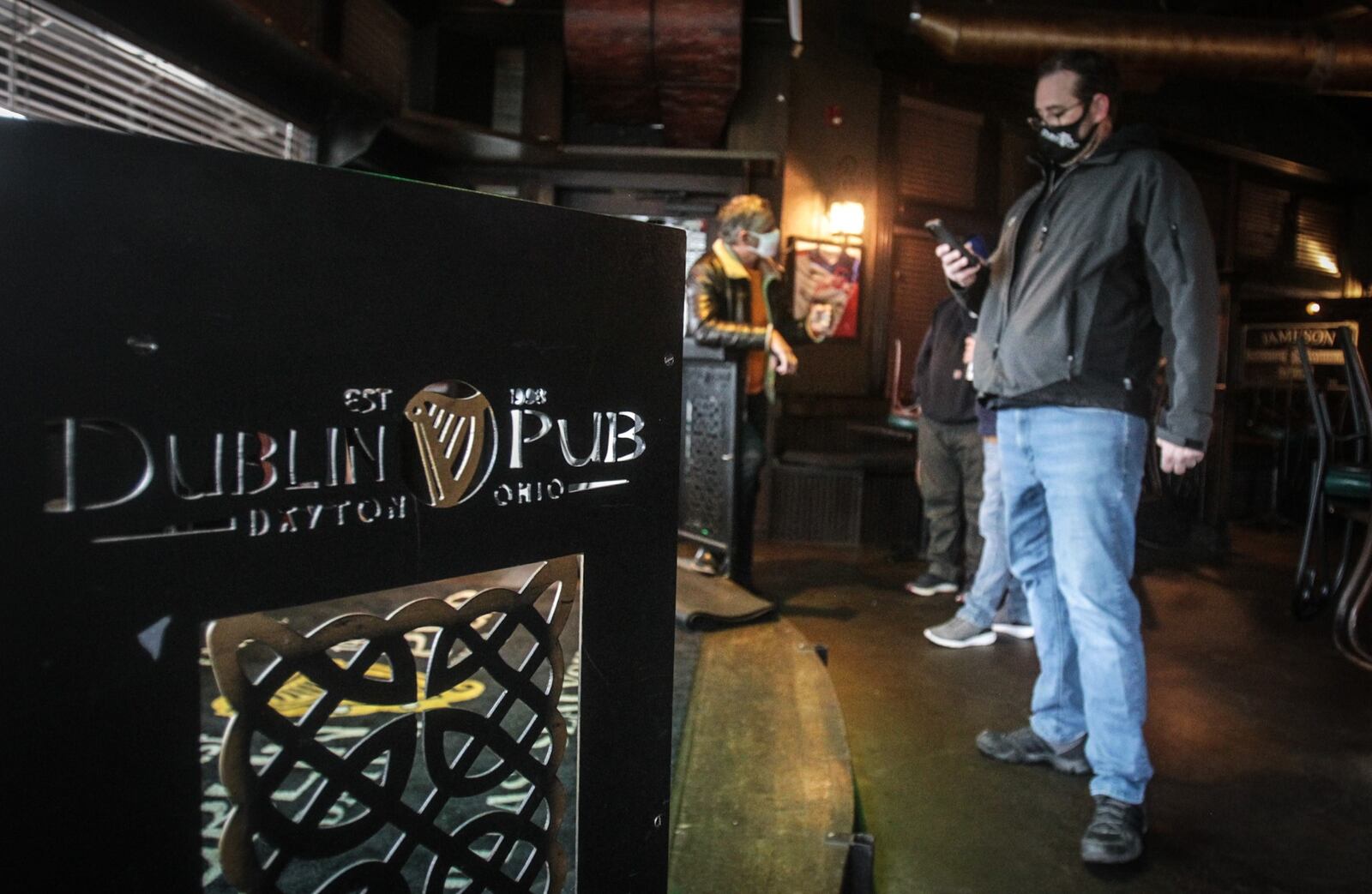 Steve Tieber, owner of Dublin Pub on Wayne Ave. in Dayton, works on plans for St. Patrick's Day celebration on Wednesday.