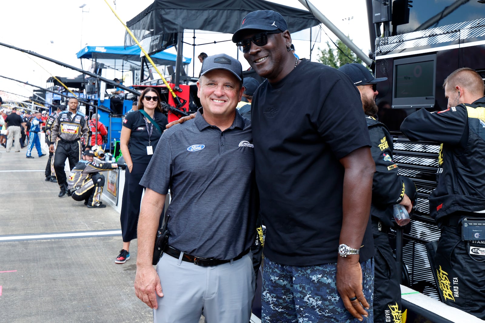 Bob Jenkins, owner of Front Row Motorsports and Co-Owner Michael Jordan, of 23XI Racing, pose before a NASCAR Cup Series auto race at Talladega Superspeedway, Sunday, Oct. 6, 2024, in Talladega, Ala. (AP Photo/ Butch Dill)