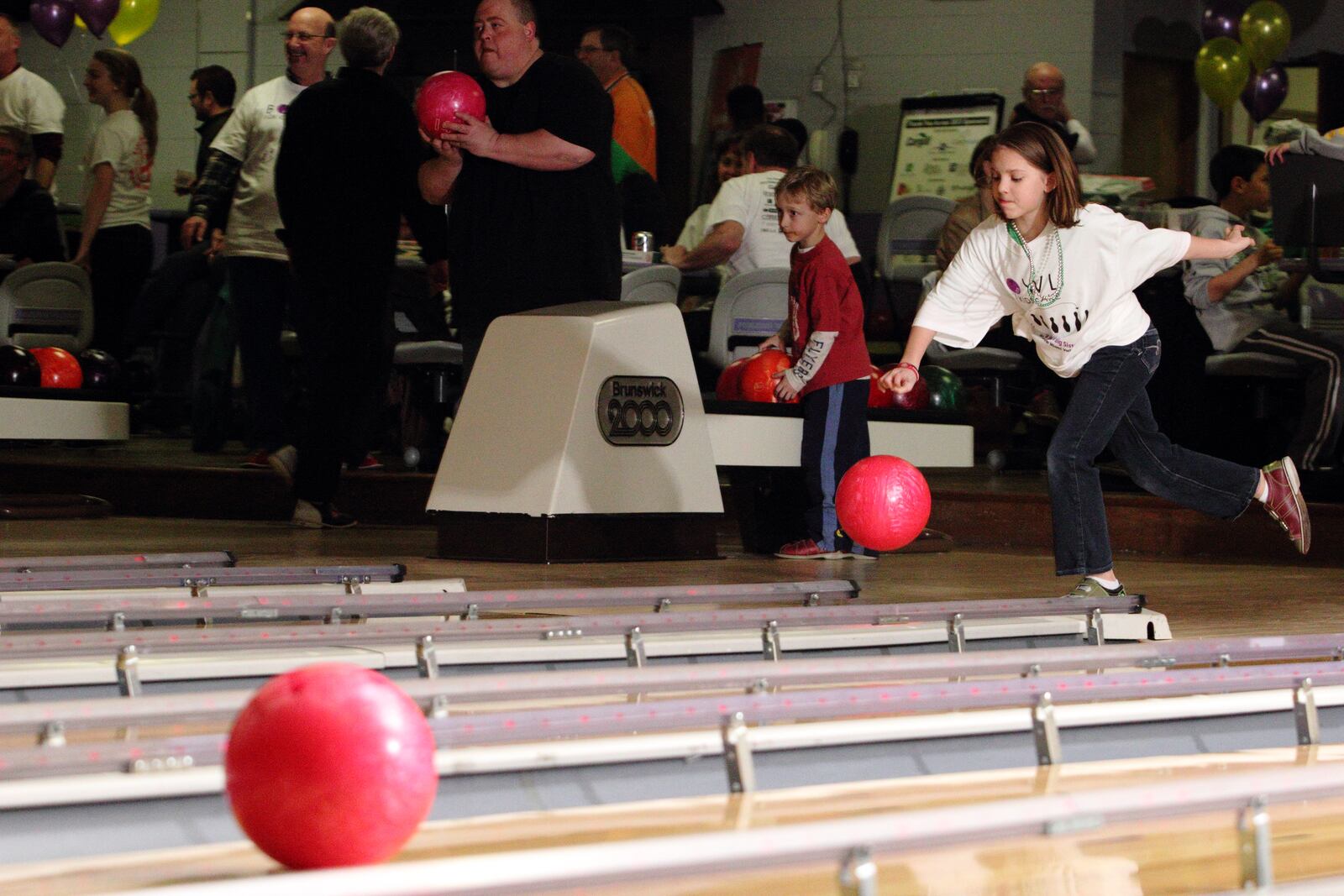 Teams participate in Bowl for Kids' Sake at Poelking Woodman Lanes in Dayton, Saturday, March 16, 2013.