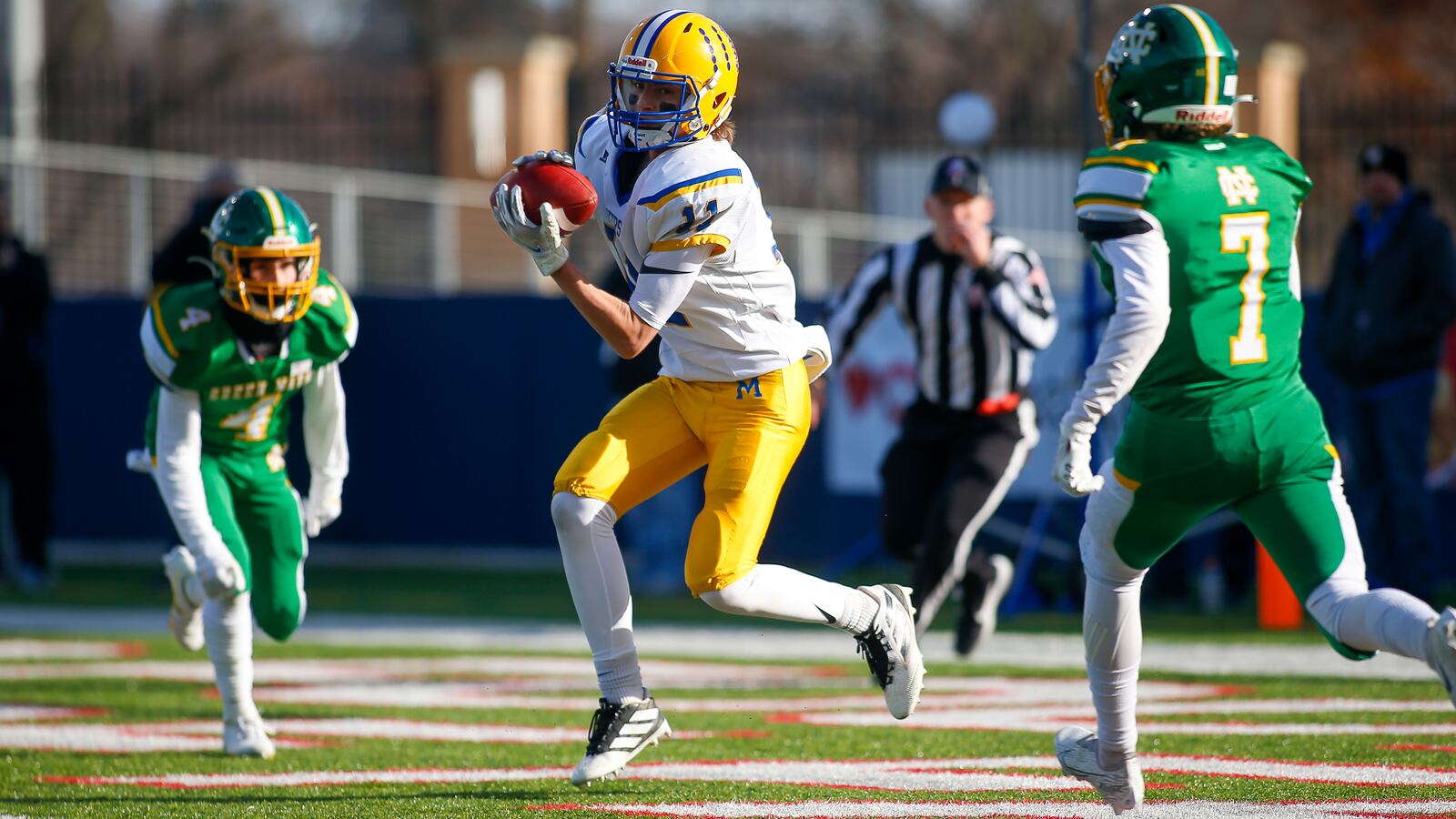 Cutline 1: Marion Local High School senior wide receiver Brady Ronnebaum catches a touchdown pass during the first quarter of the Division VII state championship game on Saturday morning at Tom Benson Hall of Fame Stadium in Canton. Michael Cooper/CONTRIBUTED