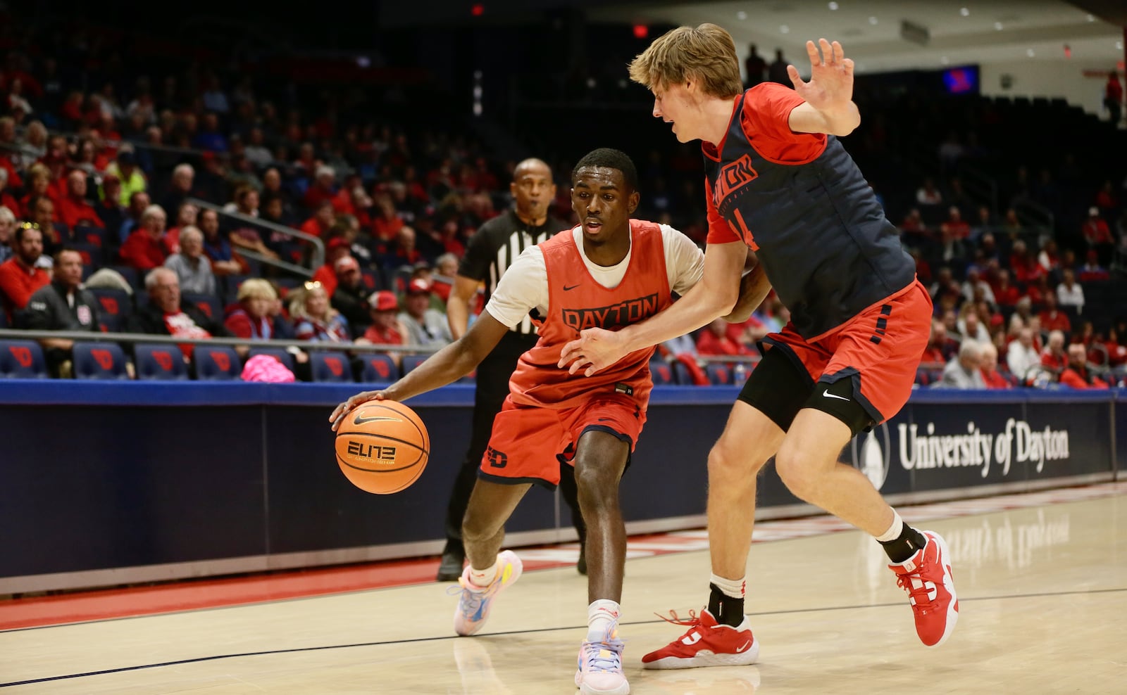 Dayton's Kobe Elvis dribbles against Atticus Schuler during the Red & Blue Game on Saturday, Oct. 15, 2022, at UD Arena. David Jablonski/Staff